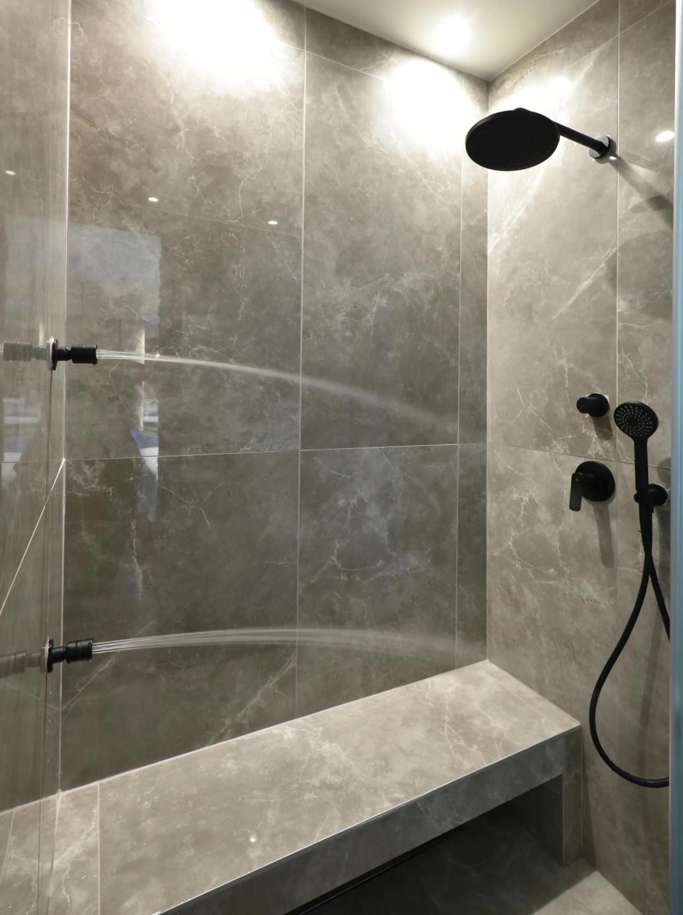 Shower in CORYLUS Luxury Rooms & Suites