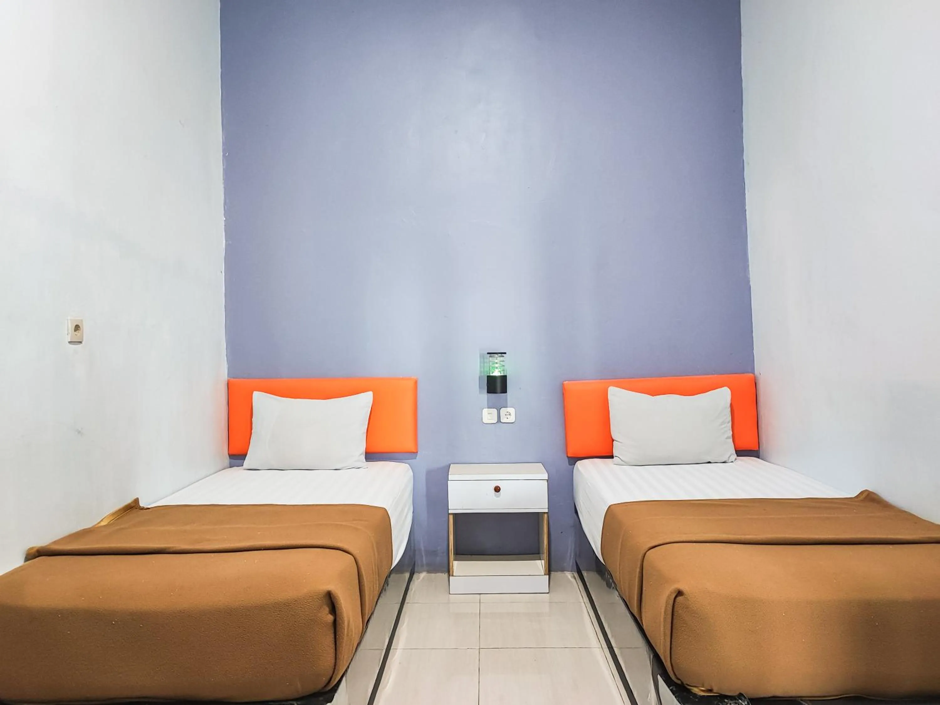 Bedroom, Bed in Reddoorz @ Hotel Bersaudara Bungo