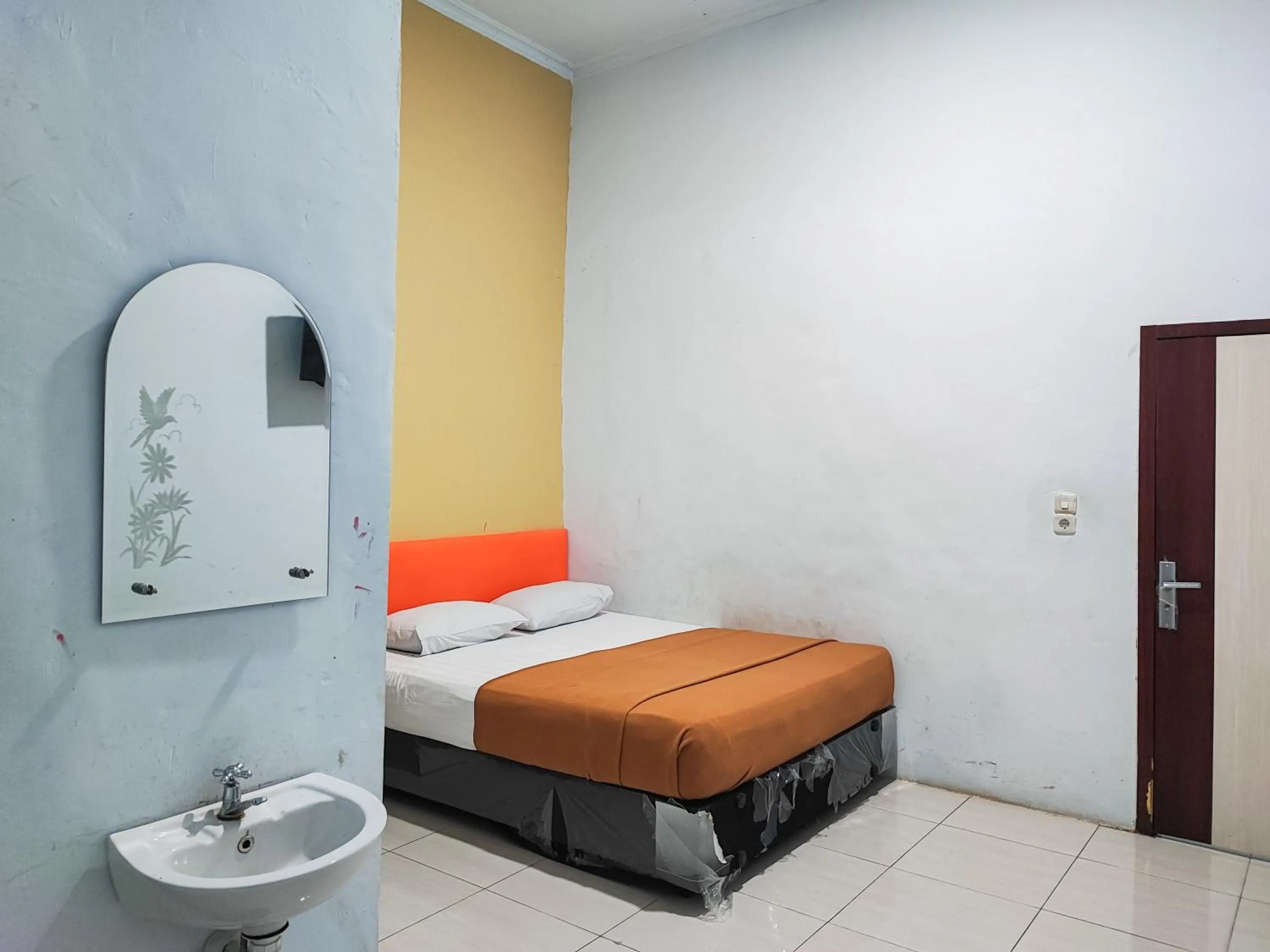 Bed in Reddoorz @ Hotel Bersaudara Bungo