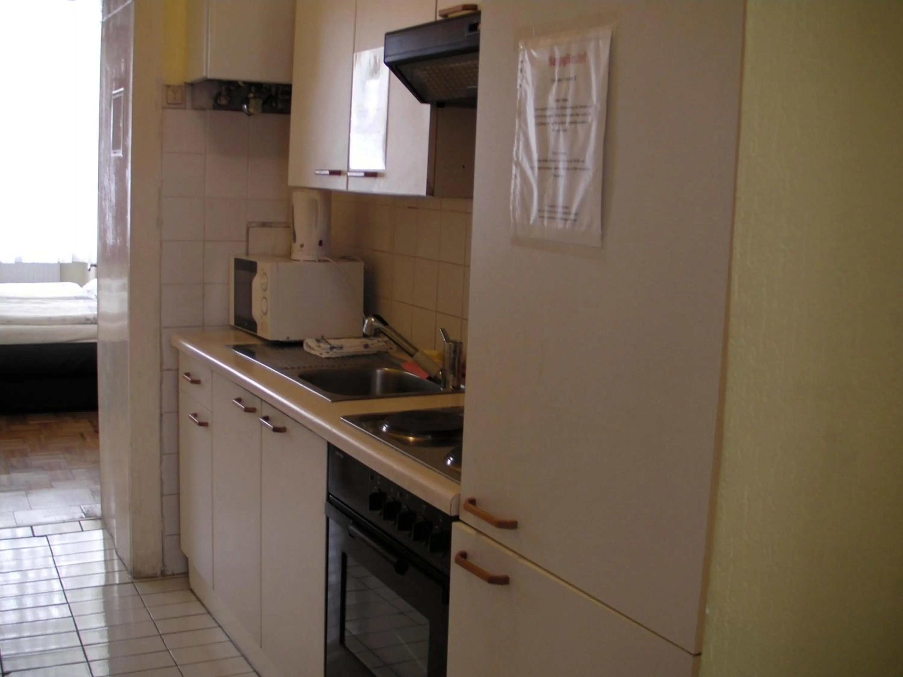 Kitchen or kitchenette in HappyHostel