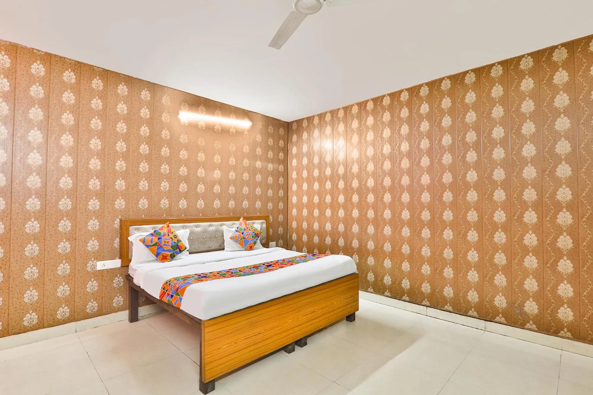 Bed in FabHotel Raas Inn