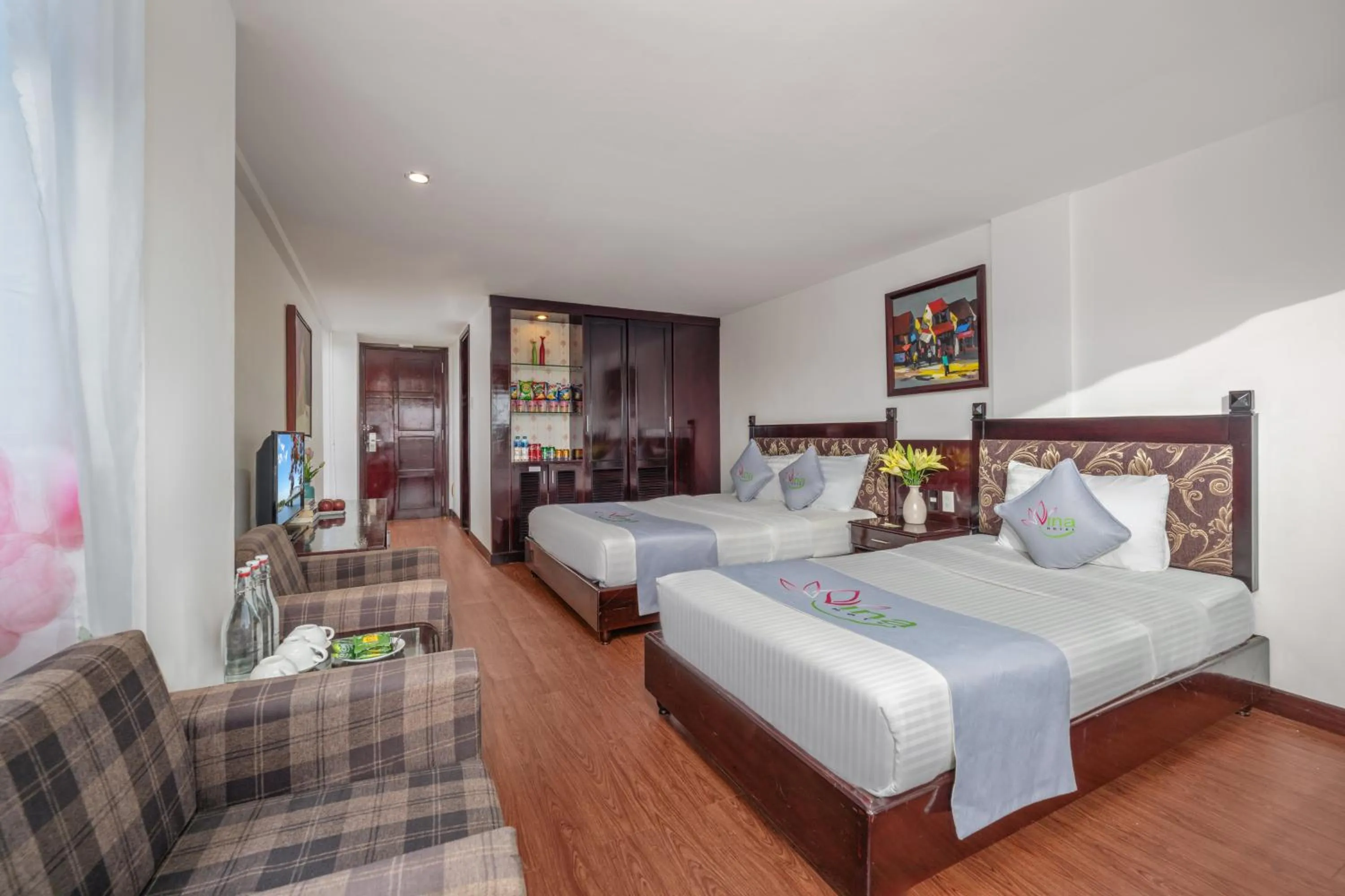 Communal lounge/ TV room, Bed in Vina Spa Hotel