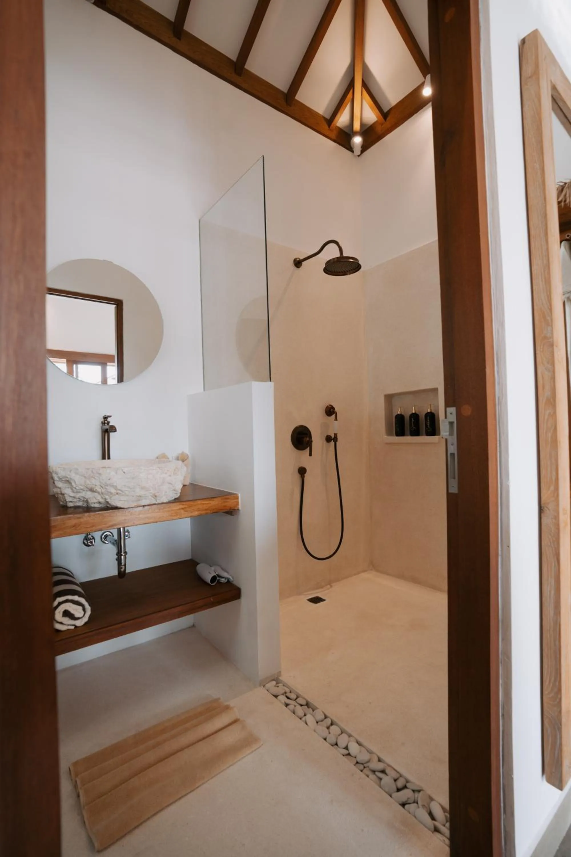 Bathroom in EHOA NYANYI BEACH Boutique Hotel - In front of entrance to NUANU