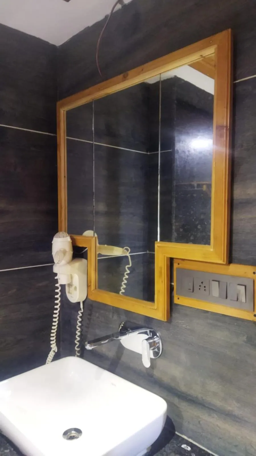 Bathroom in Hotel CM Palace - Pure Vegetarian