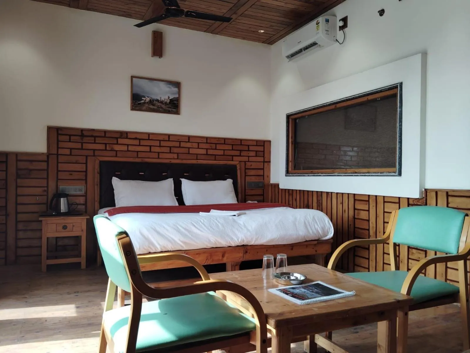 Seating area, Bed in Hotel CM Palace - Pure Vegetarian