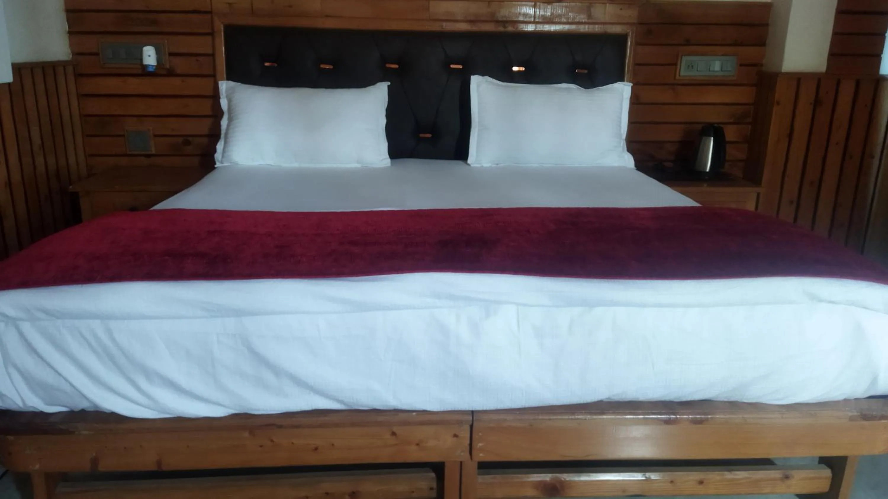 Bed in Hotel CM Palace - Pure Vegetarian