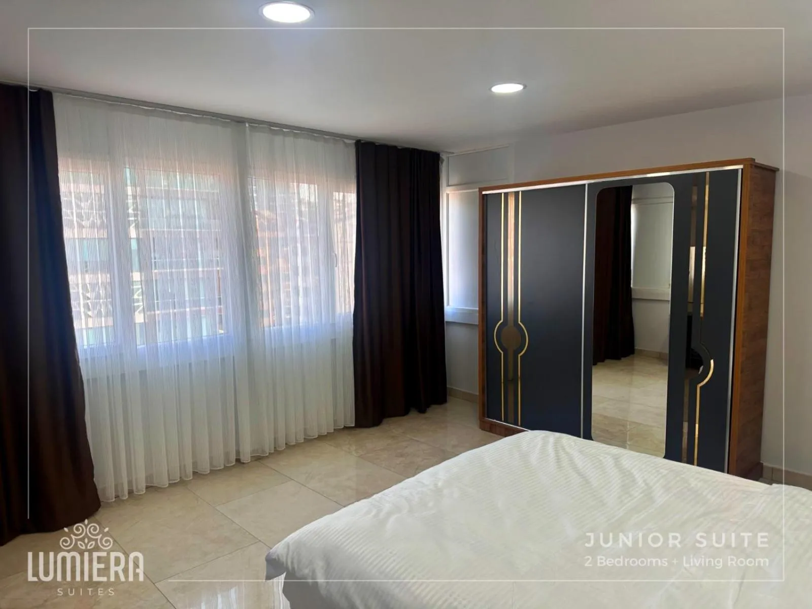 Photo of the whole room, Bed in Lumiera Suites Hotel