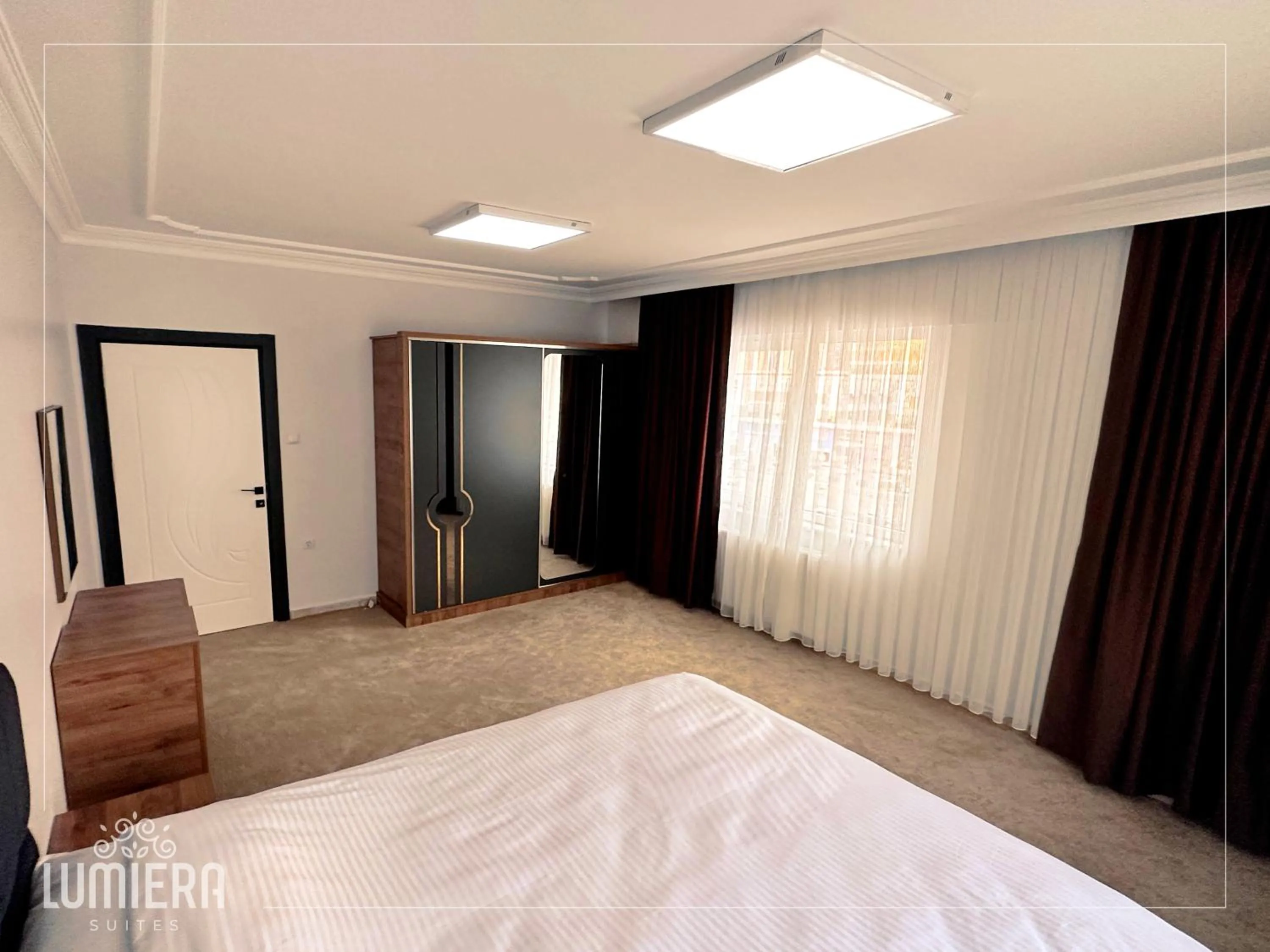 Photo of the whole room, Bed in Lumiera Suites Hotel