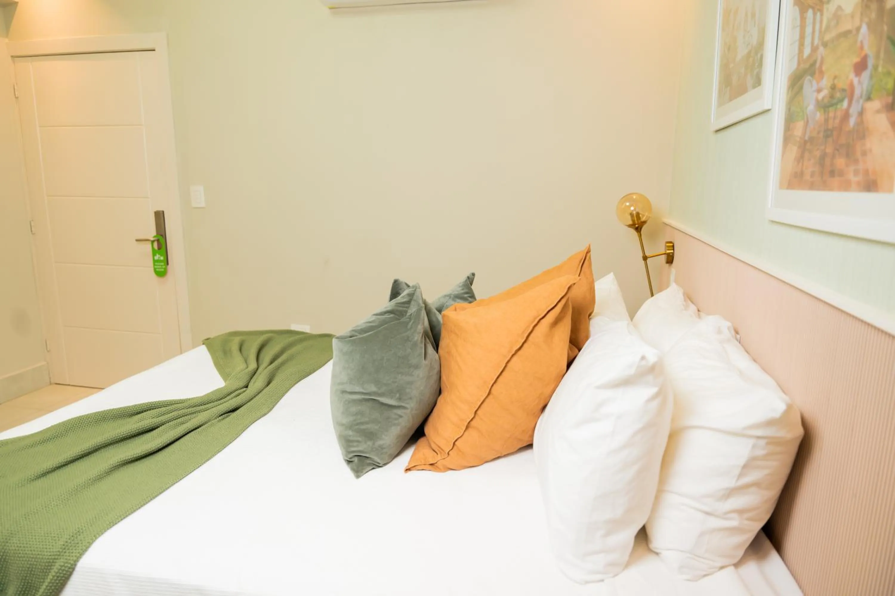 Bed in Hotel Stay Here Suites