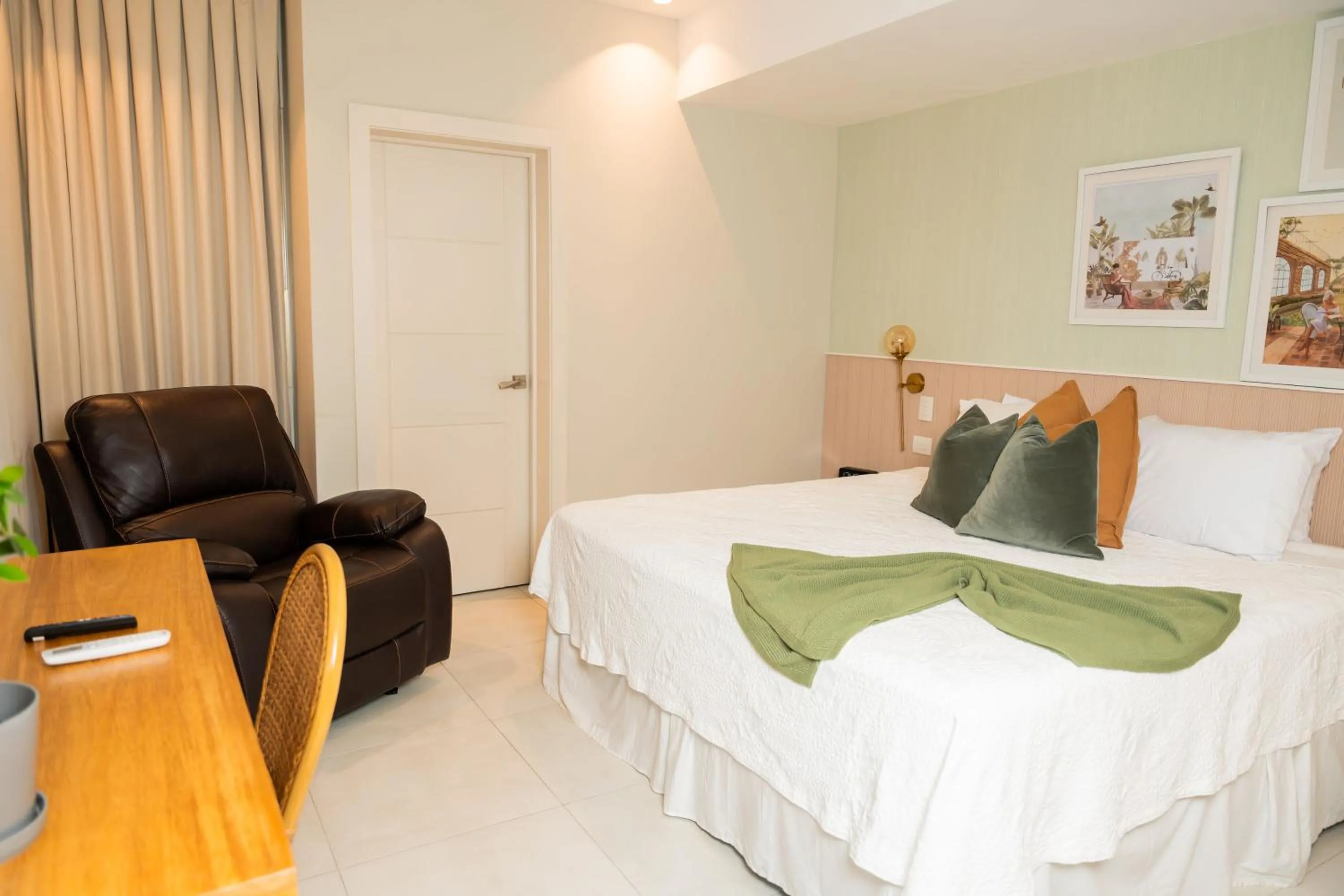 Bed in Hotel Stay Here Suites