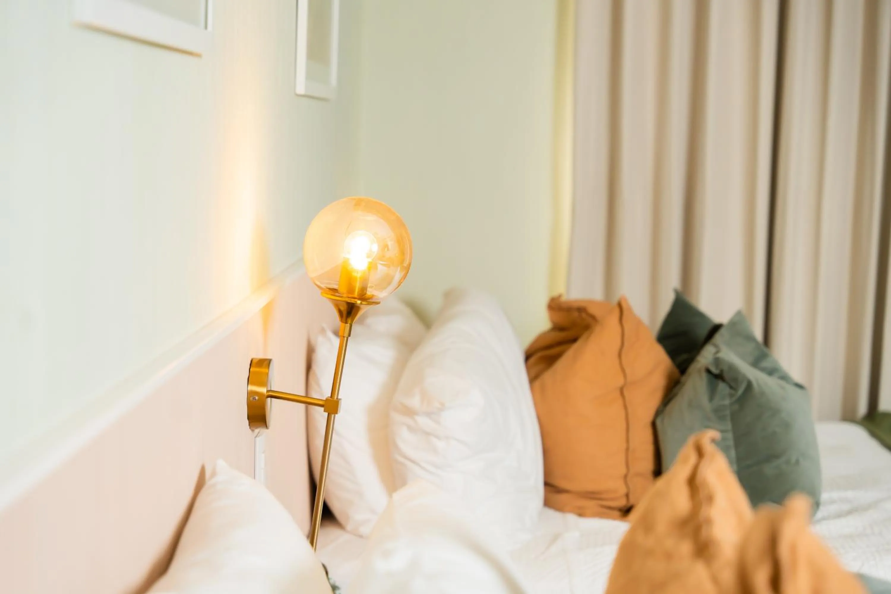 Bed in Hotel Stay Here Suites