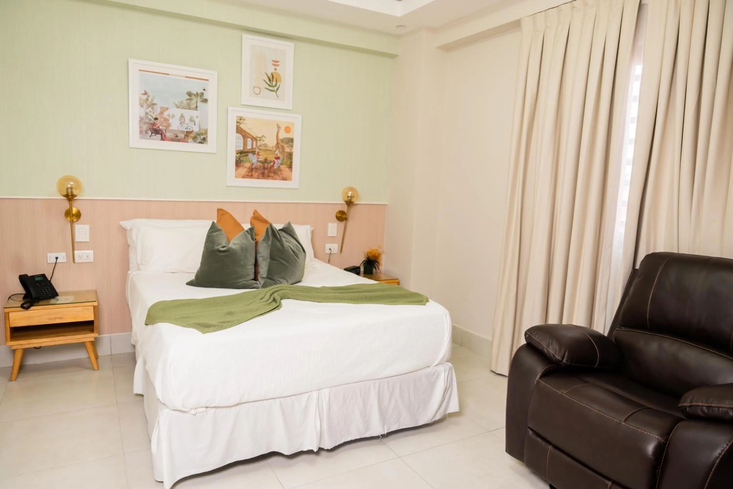 Bed in Hotel Stay Here Suites