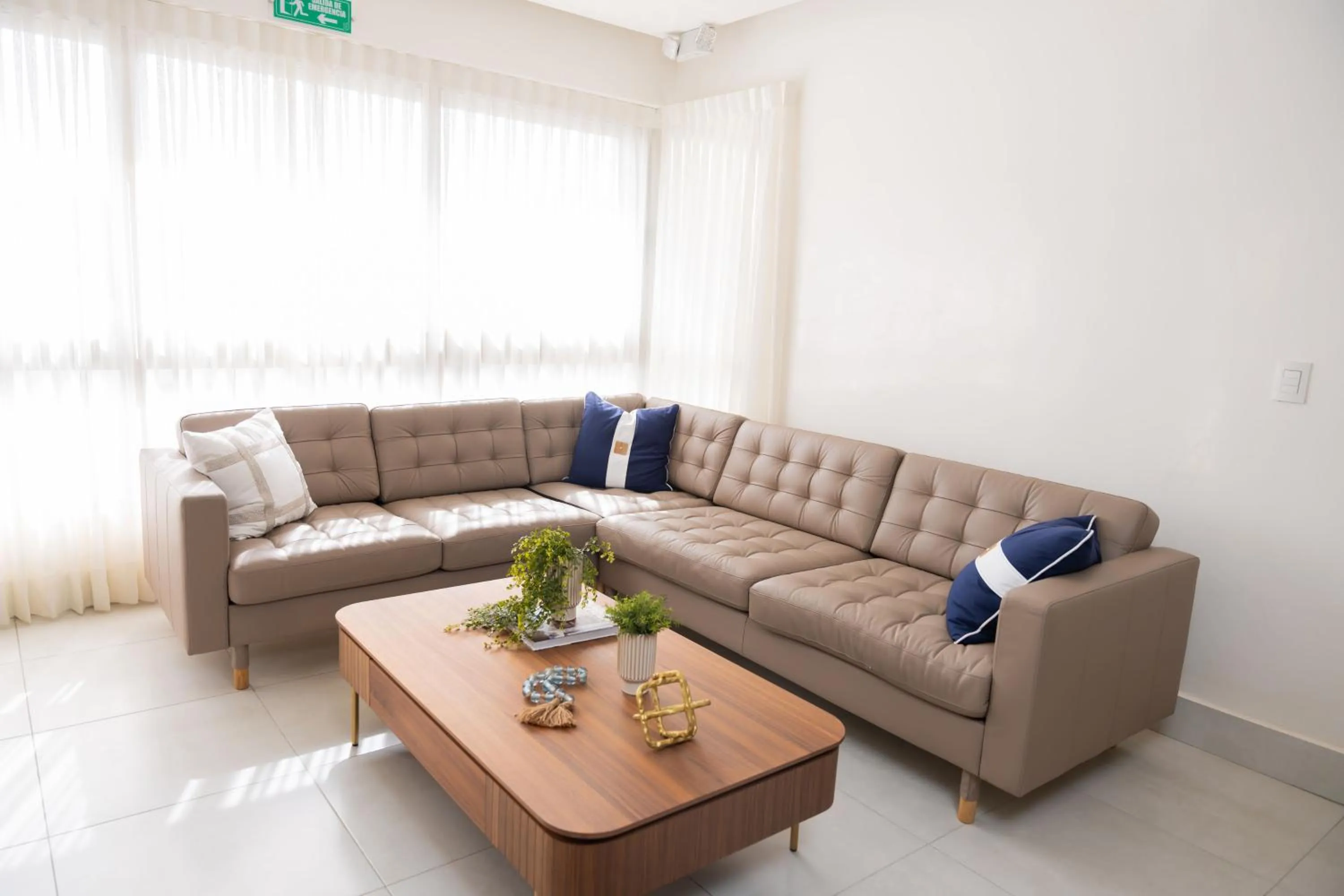 Living room in Hotel Stay Here Suites