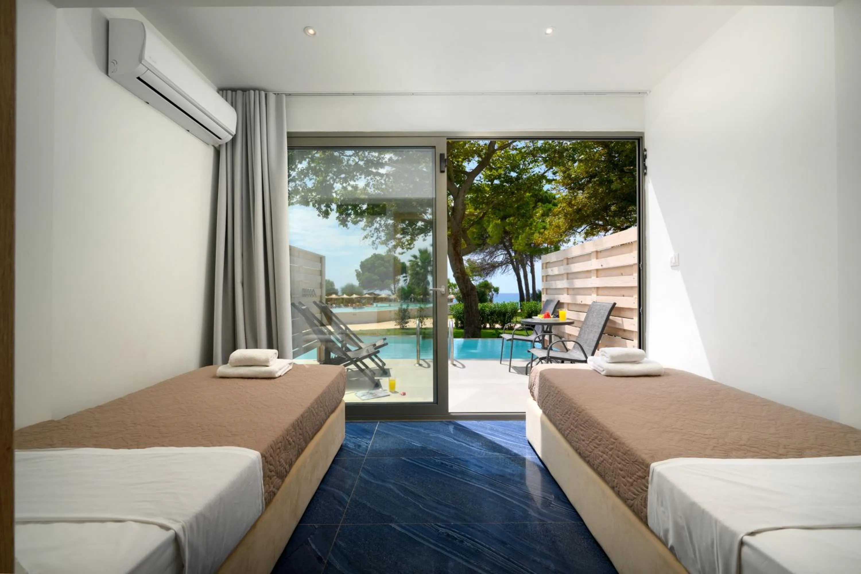 Seating area, Bed in Ninos Grand Beach Resort