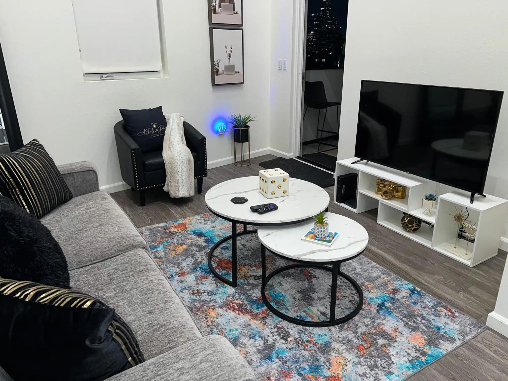 Communal lounge/ TV room in Downtown Los Angeles Skyline balcony view Modern Penthouse