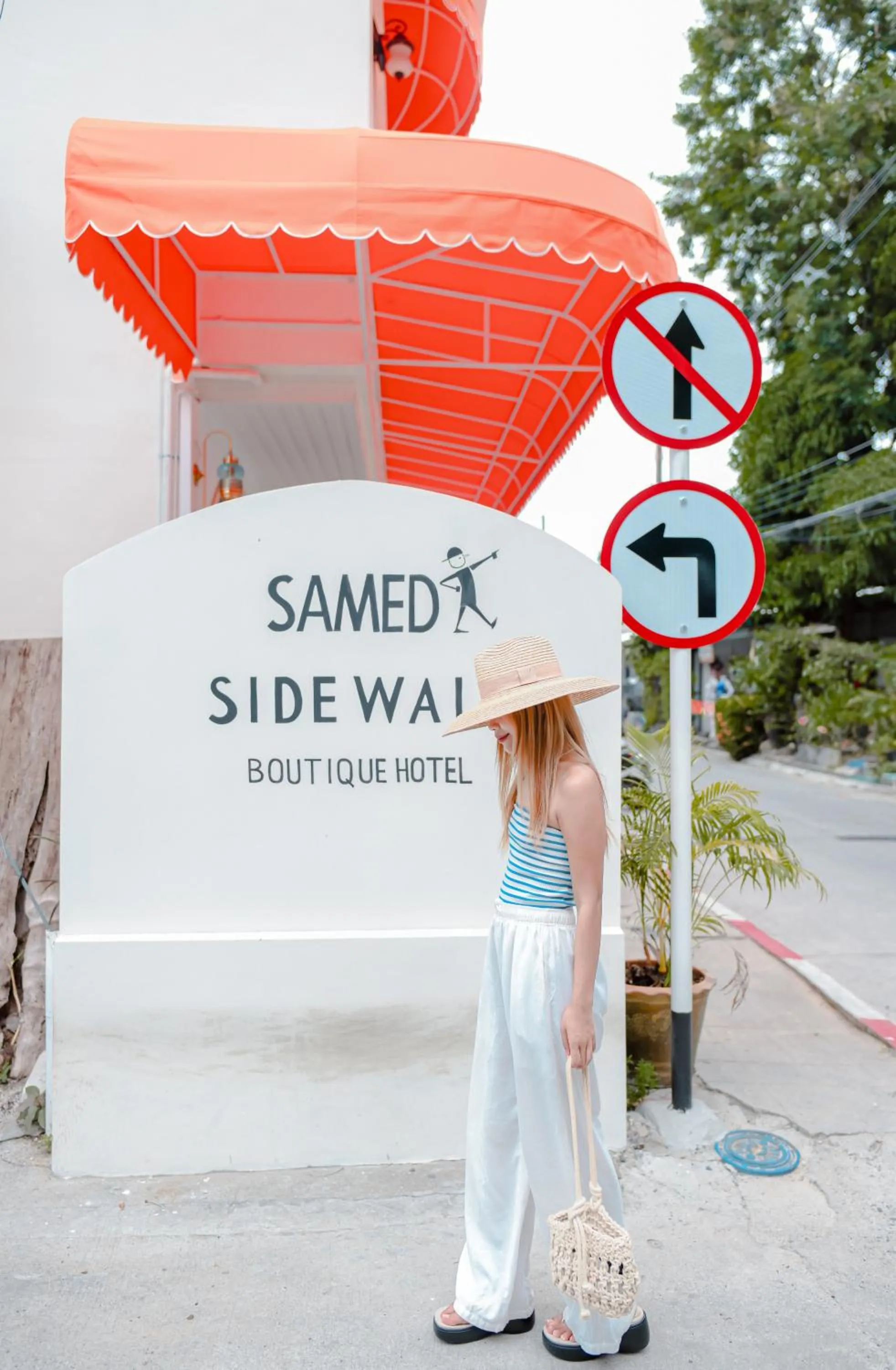 Property logo or sign in Sidewalk Boutique Hotel