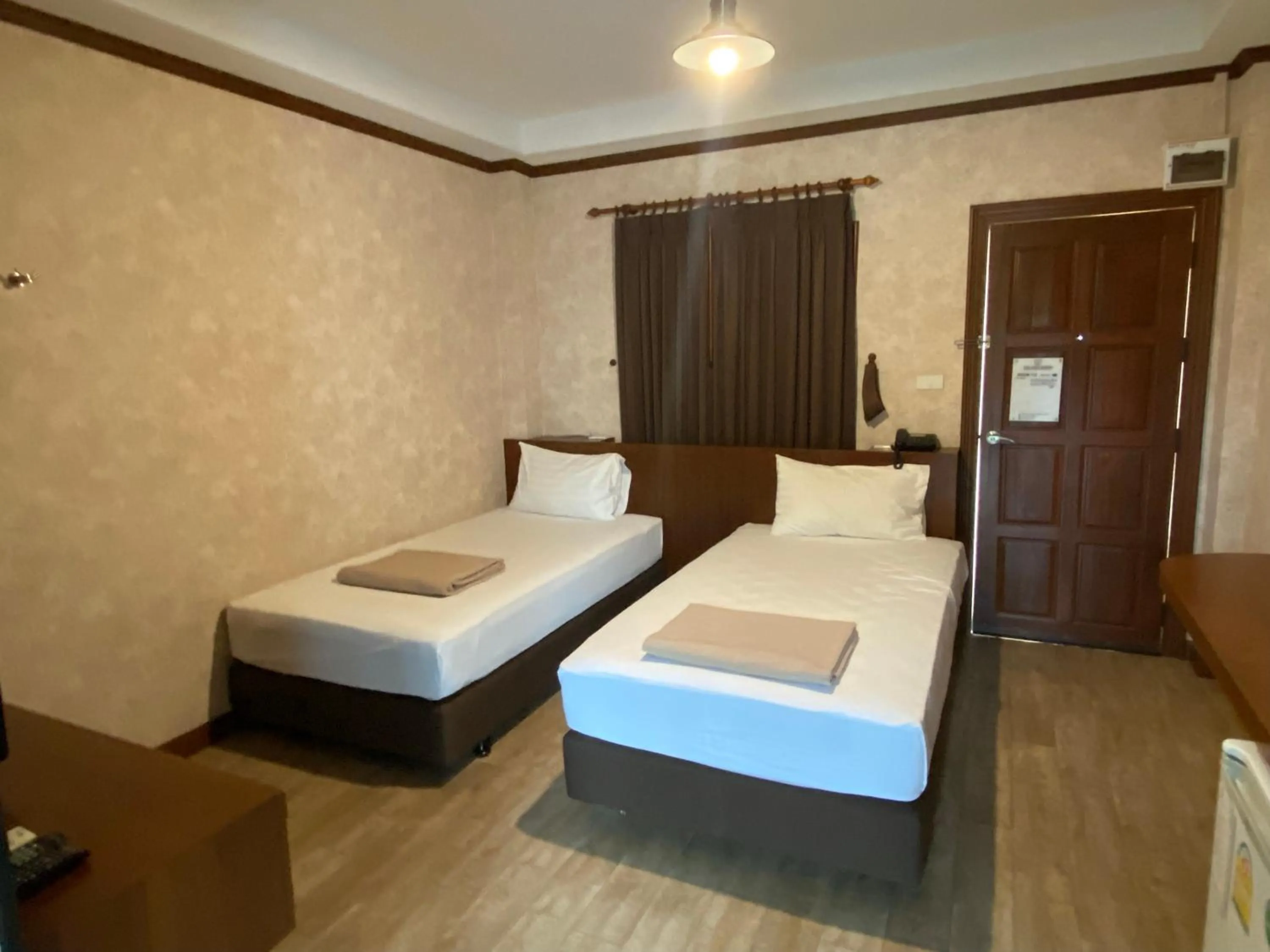 Bed in RoomQuest Chonburi Laem Chabang