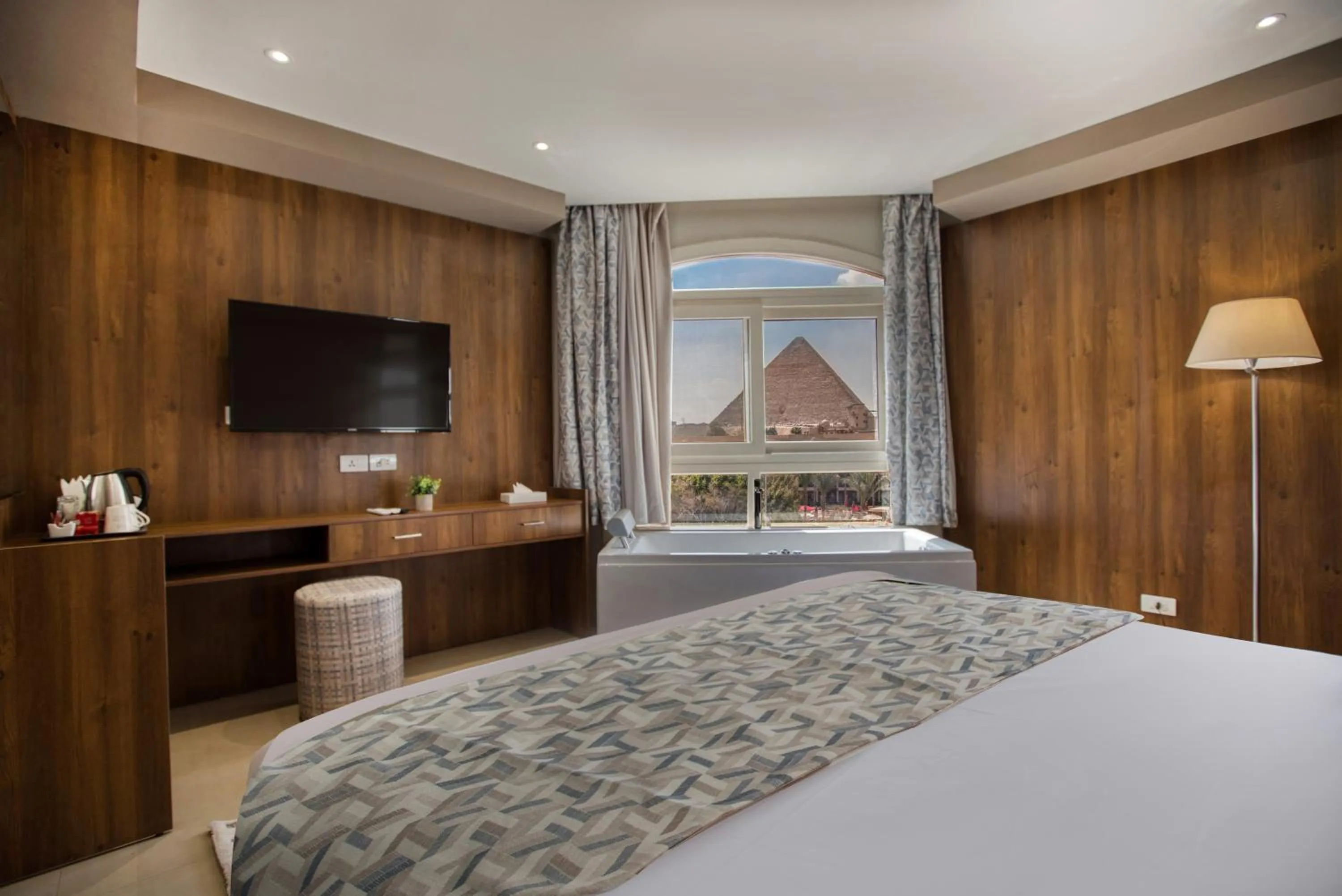 Bed in Nozol Pyramids Hotel and Spa