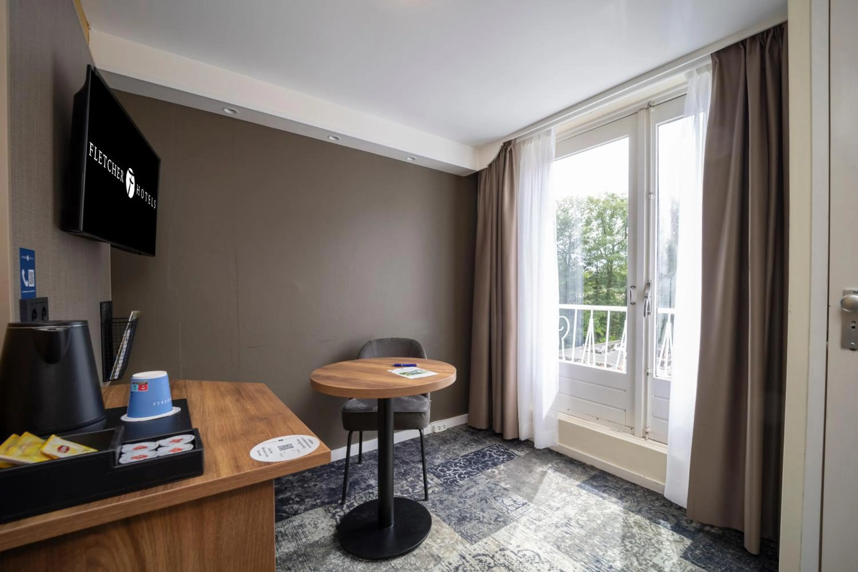 TV and multimedia in Fletcher Hotel Restaurant Erica