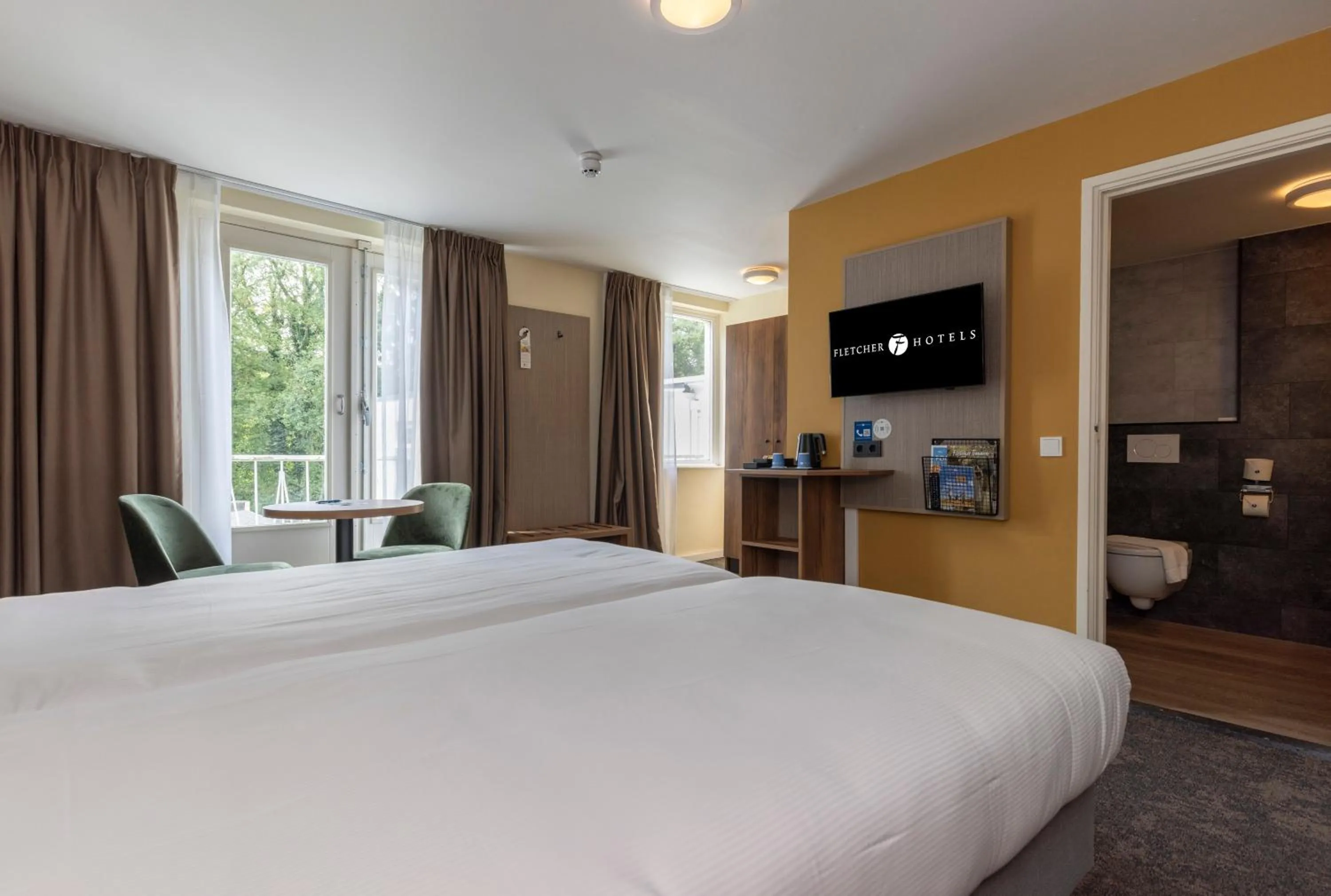 Photo of the whole room, Bed in Fletcher Hotel Restaurant Erica