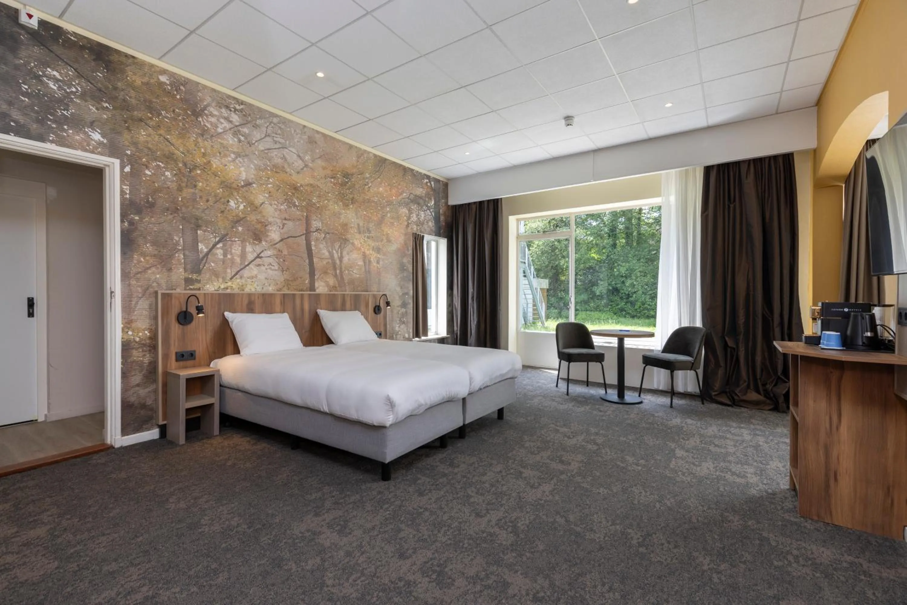 Bed in Fletcher Hotel Restaurant Erica