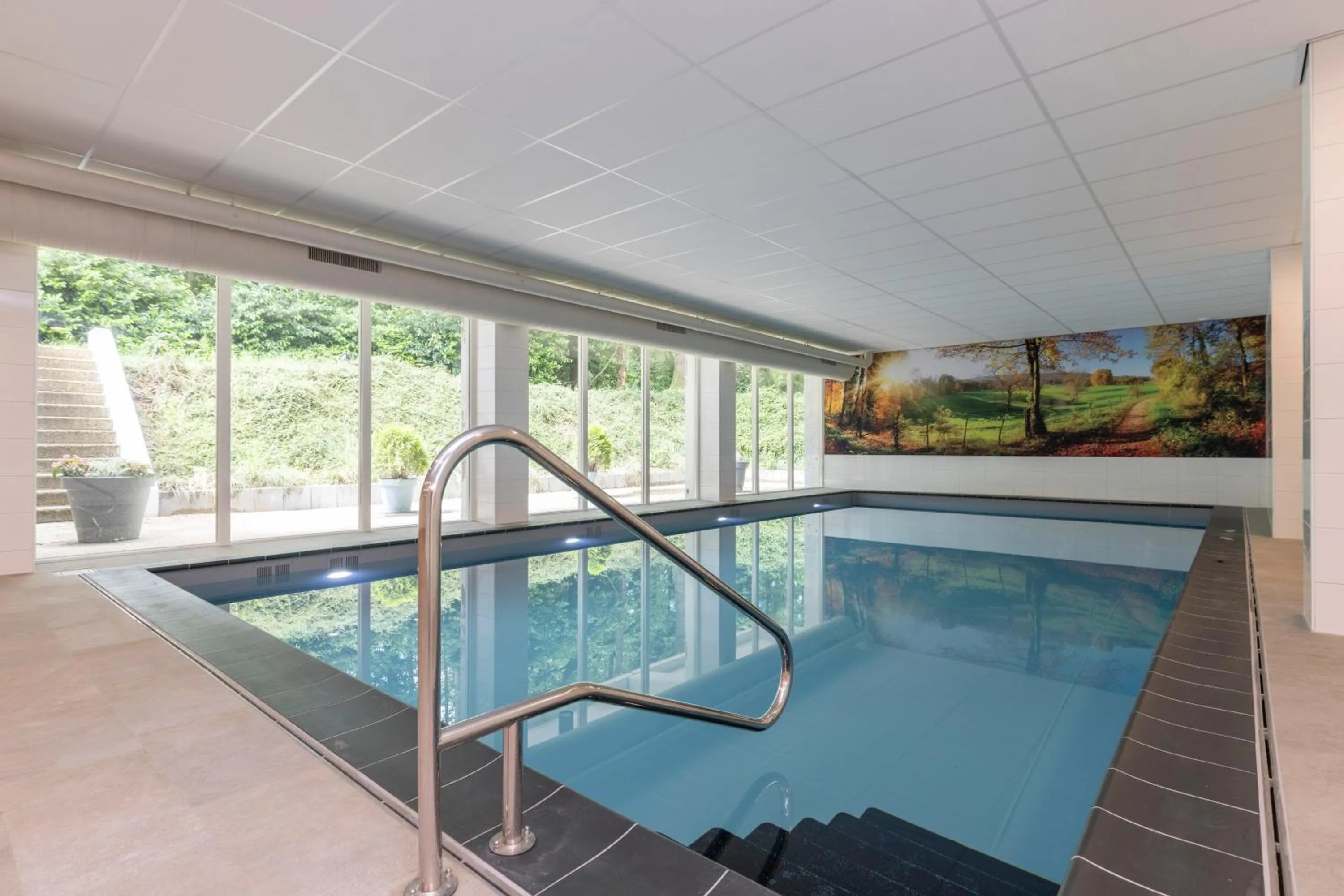 Swimming pool in Fletcher Hotel Restaurant Erica