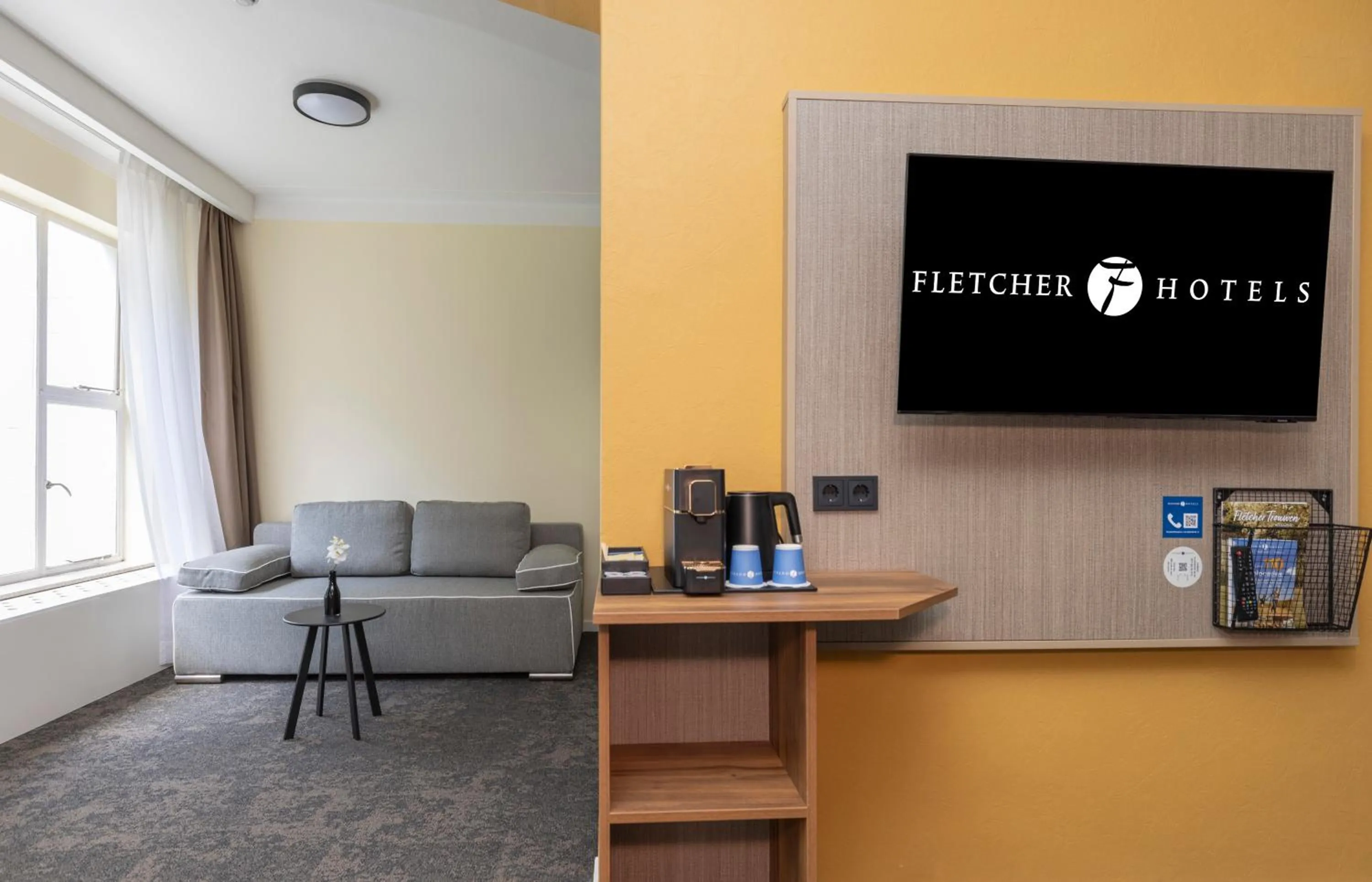 TV and multimedia in Fletcher Hotel Restaurant Erica