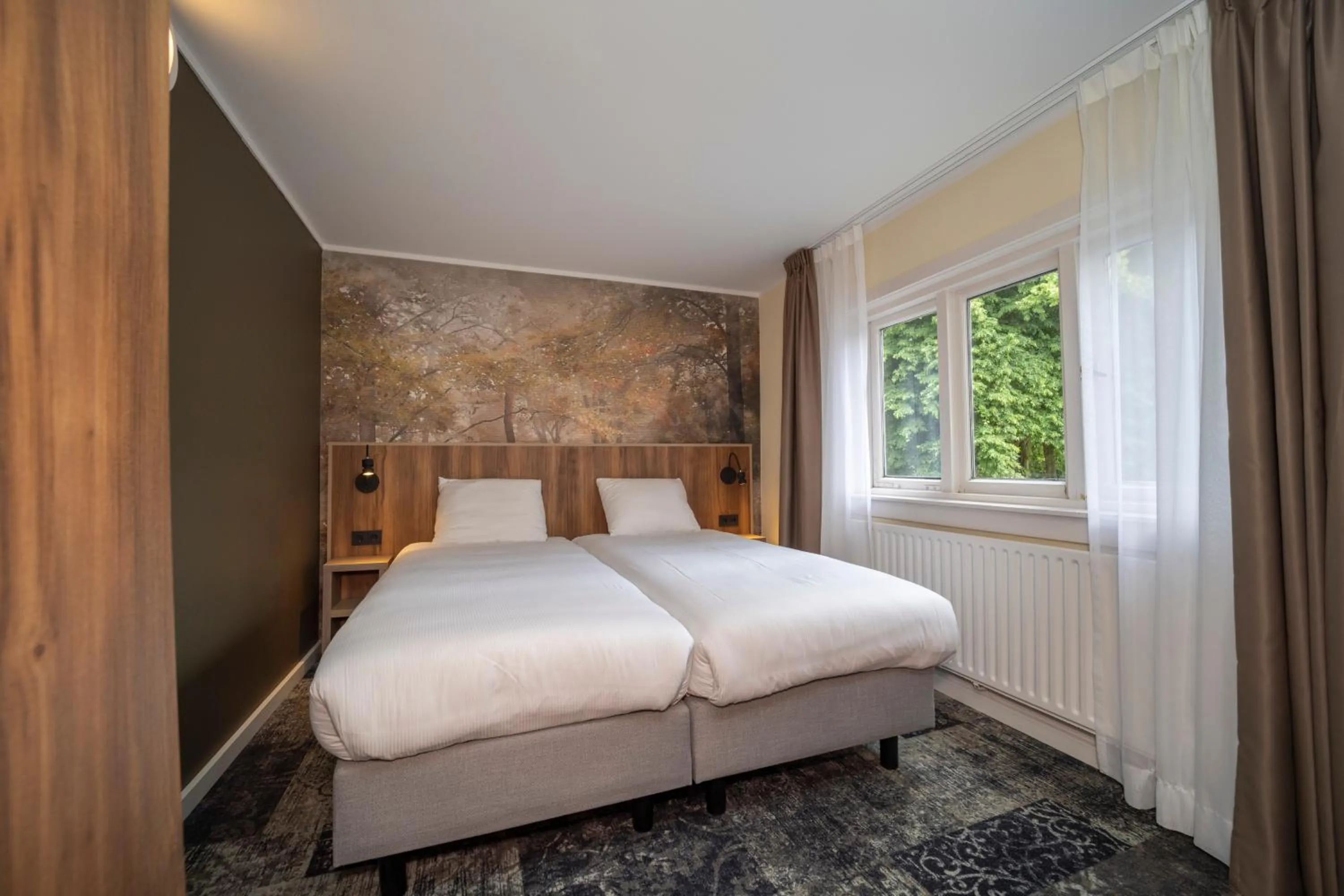 Bed in Fletcher Hotel Restaurant Erica