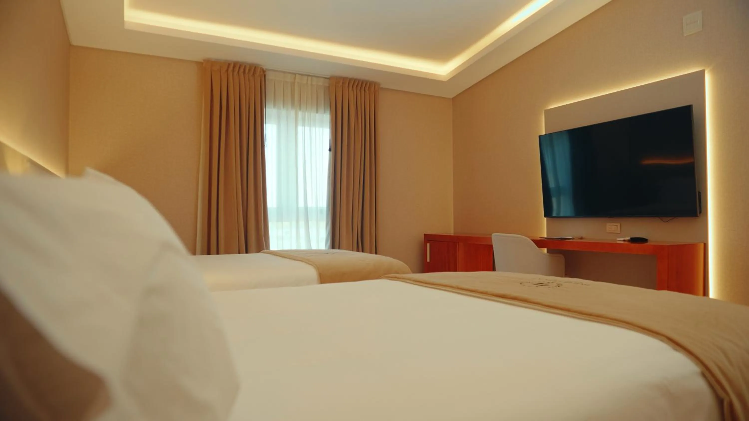 Bedroom in HT Hotel Deluxe Resort & SPA