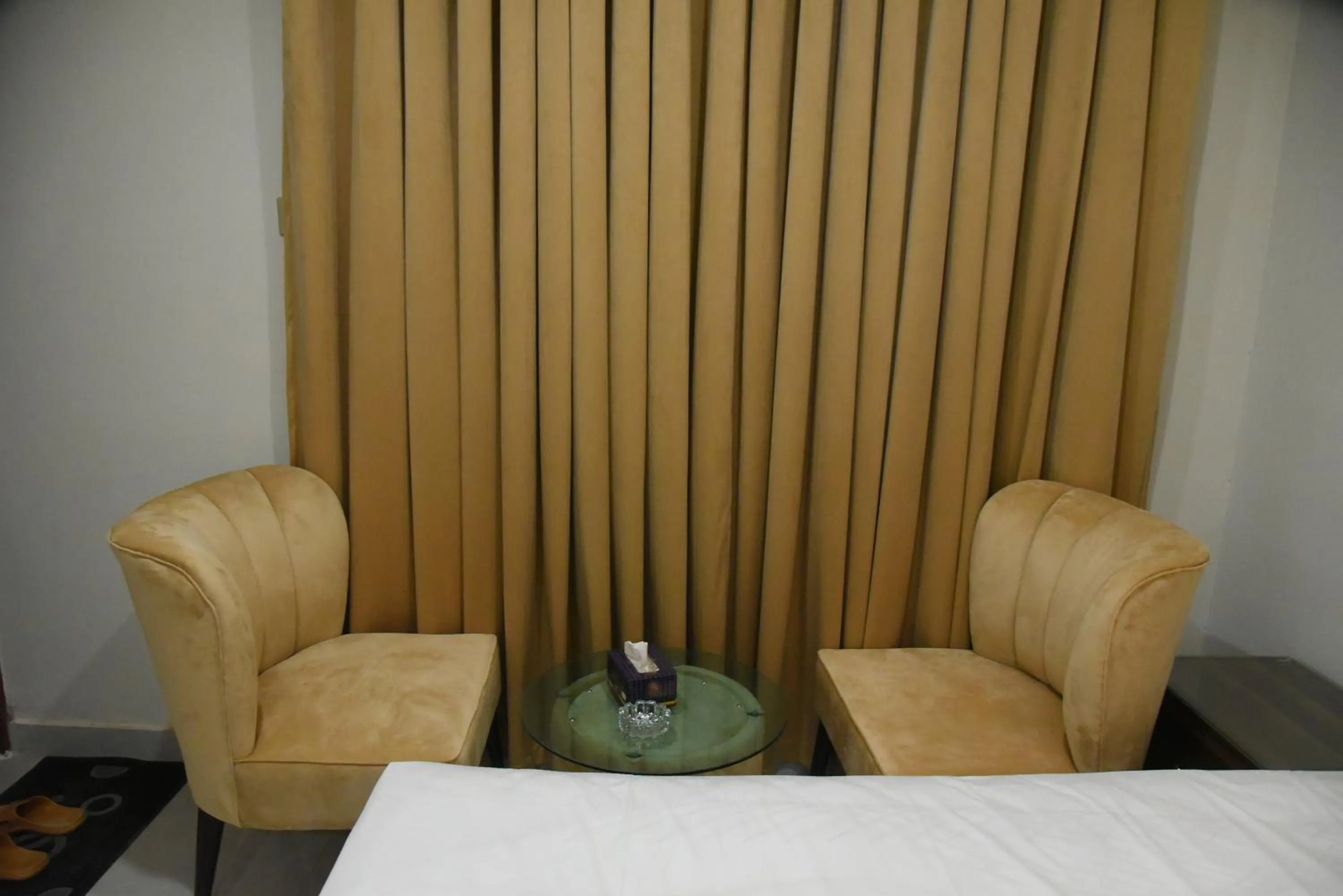 Seating area, Bed in Hotel white season Gulberg