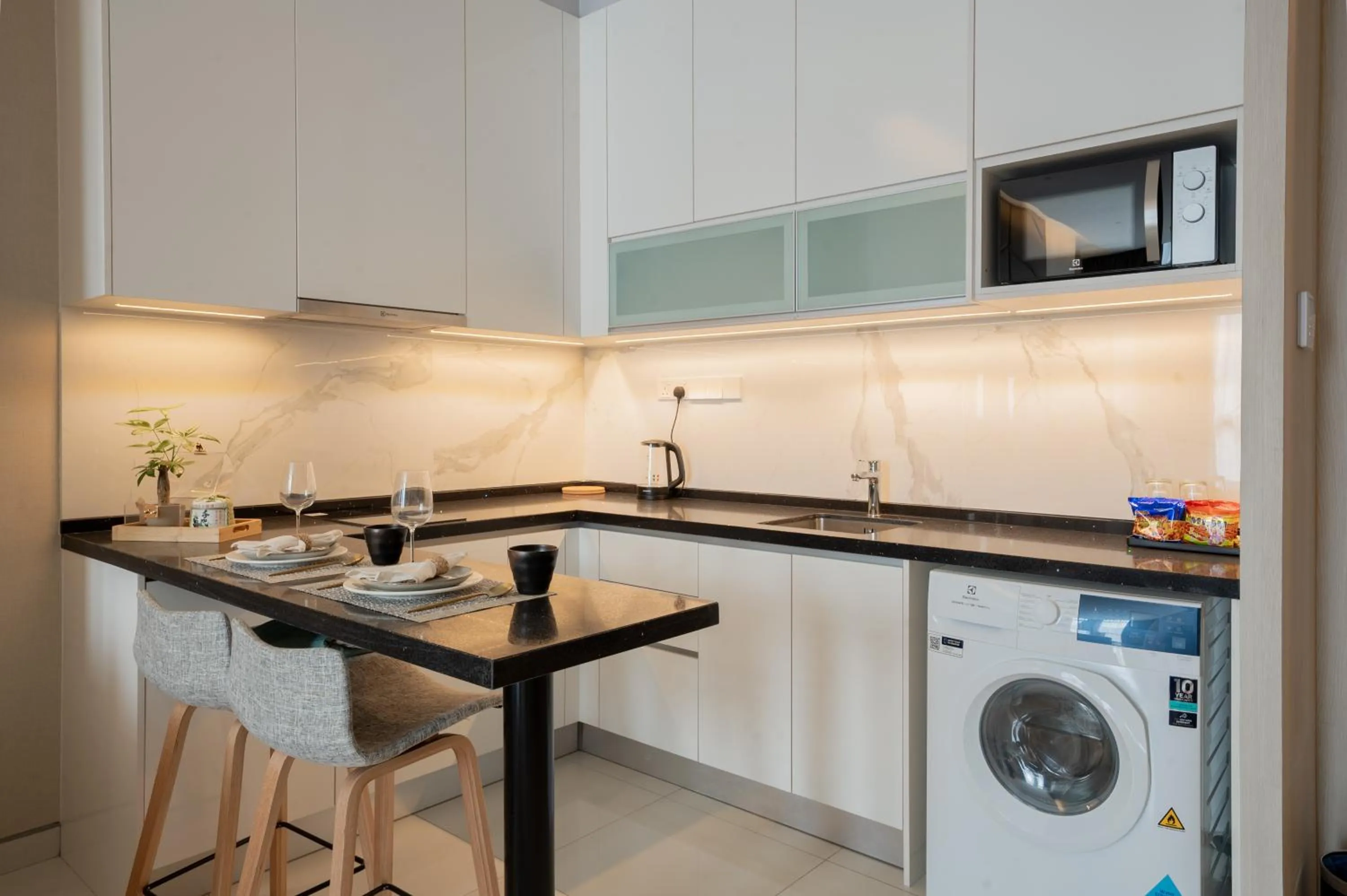 washing machine in Societe Suite by Lyfehaus