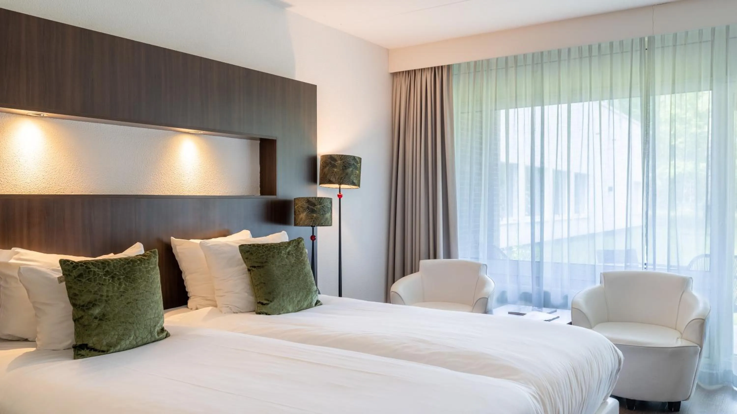 Seating area, Bed in Van der Valk Hotel Assen