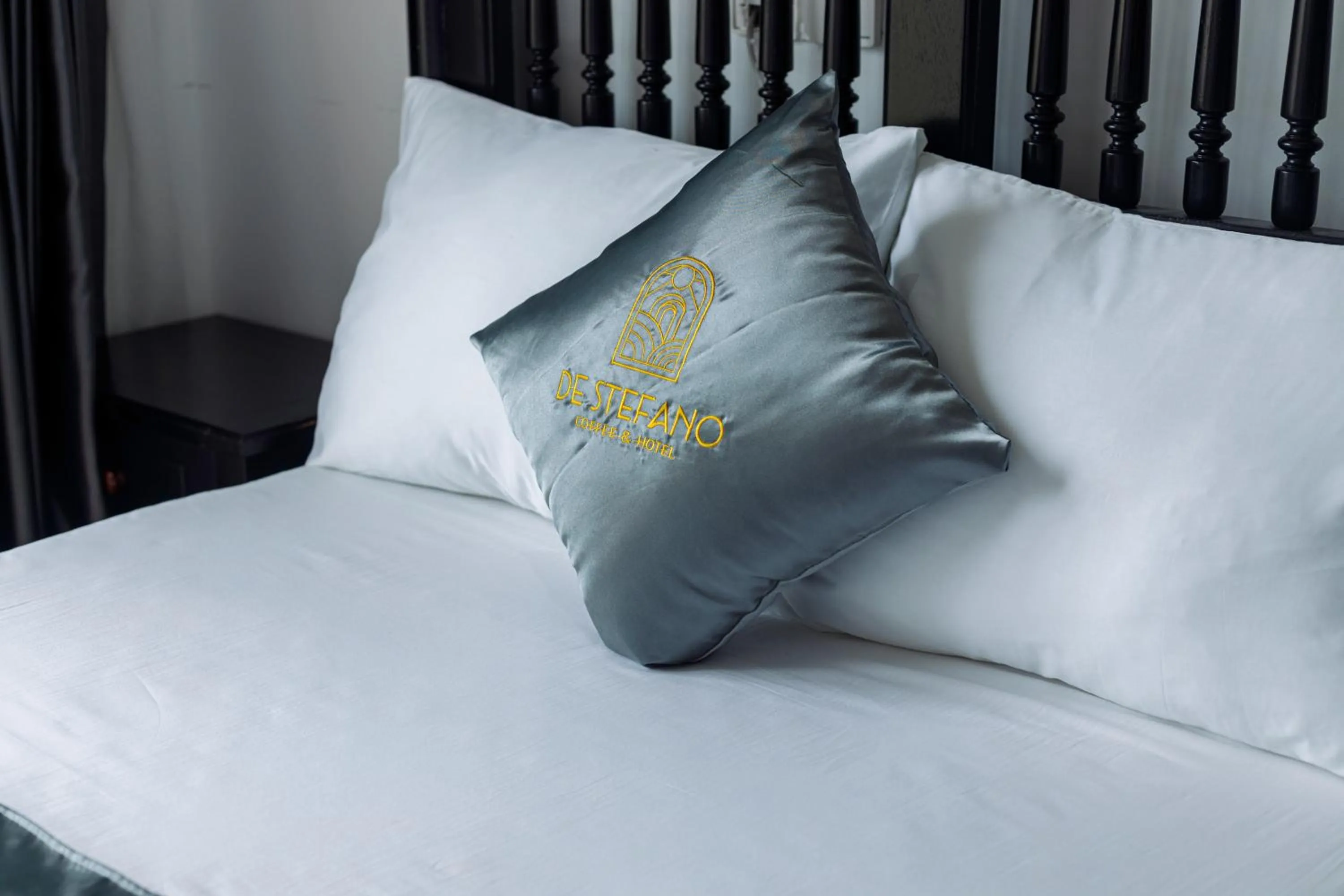 Bed in De Stefano Coffee and Hotel