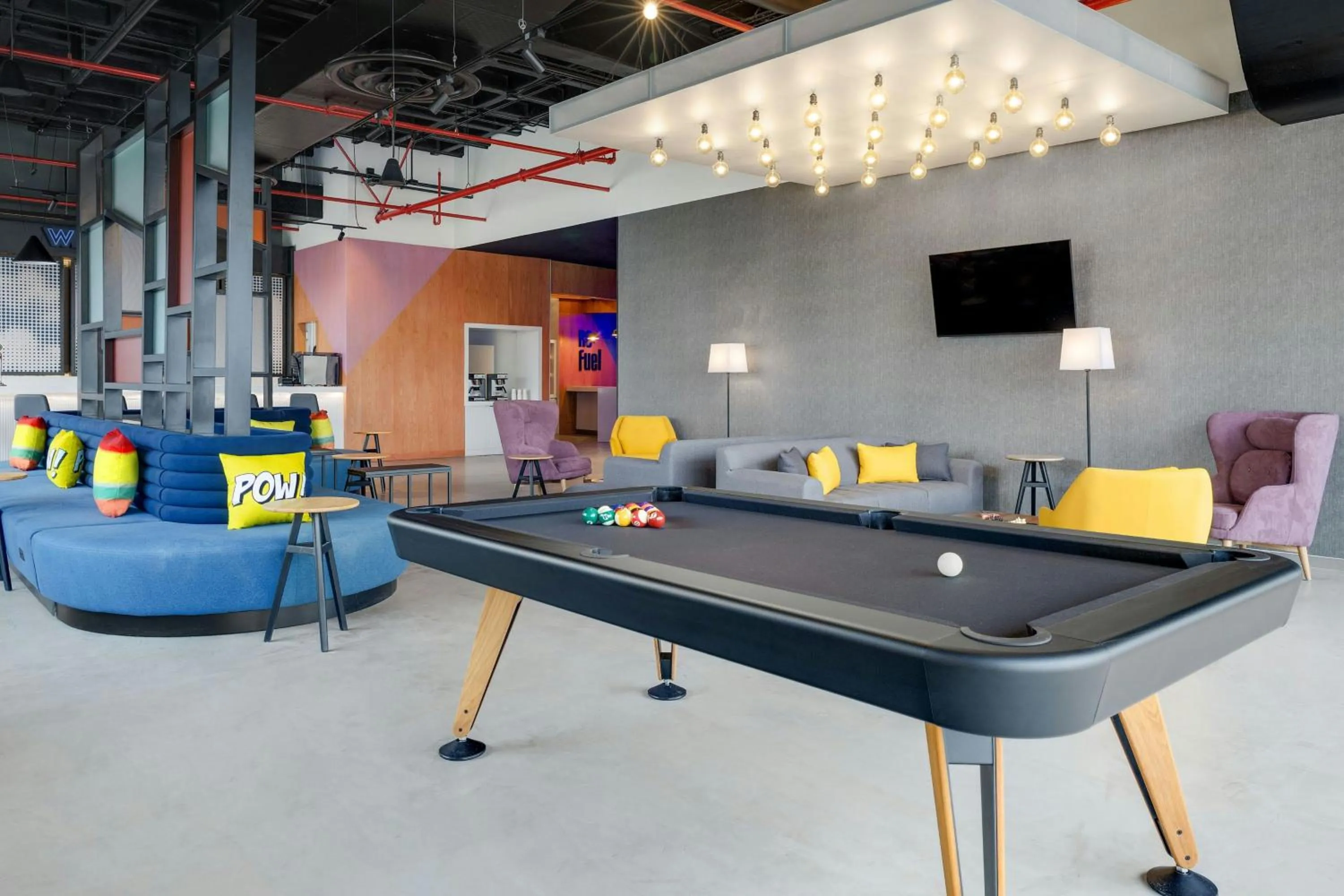 Communal lounge/ TV room in Aloft Santo Domingo Piantini