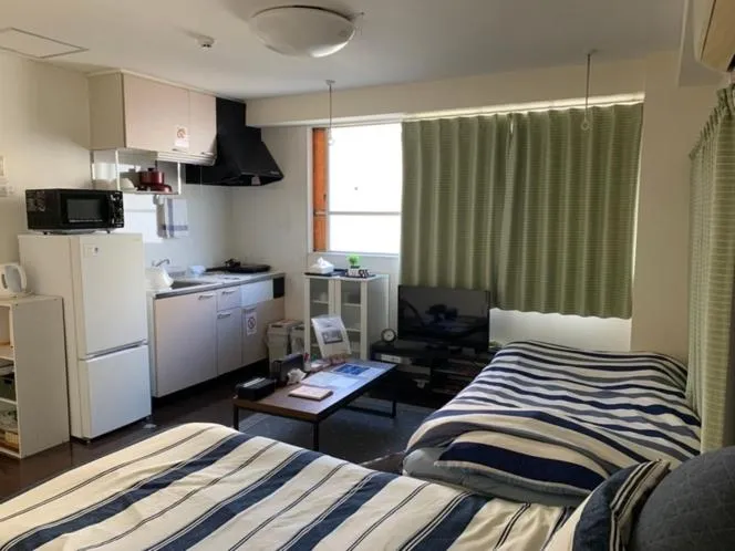 Bed in Oyado Kinokuniya Daikokumachi