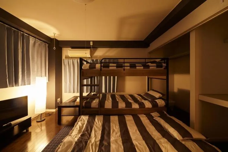 Bed in Oyado Kinokuniya Daikokumachi