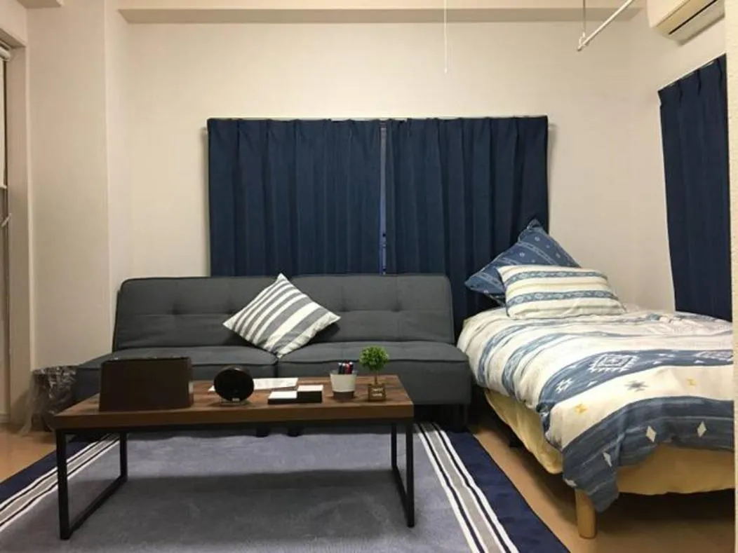 Bed in Oyado Kinokuniya Daikokumachi