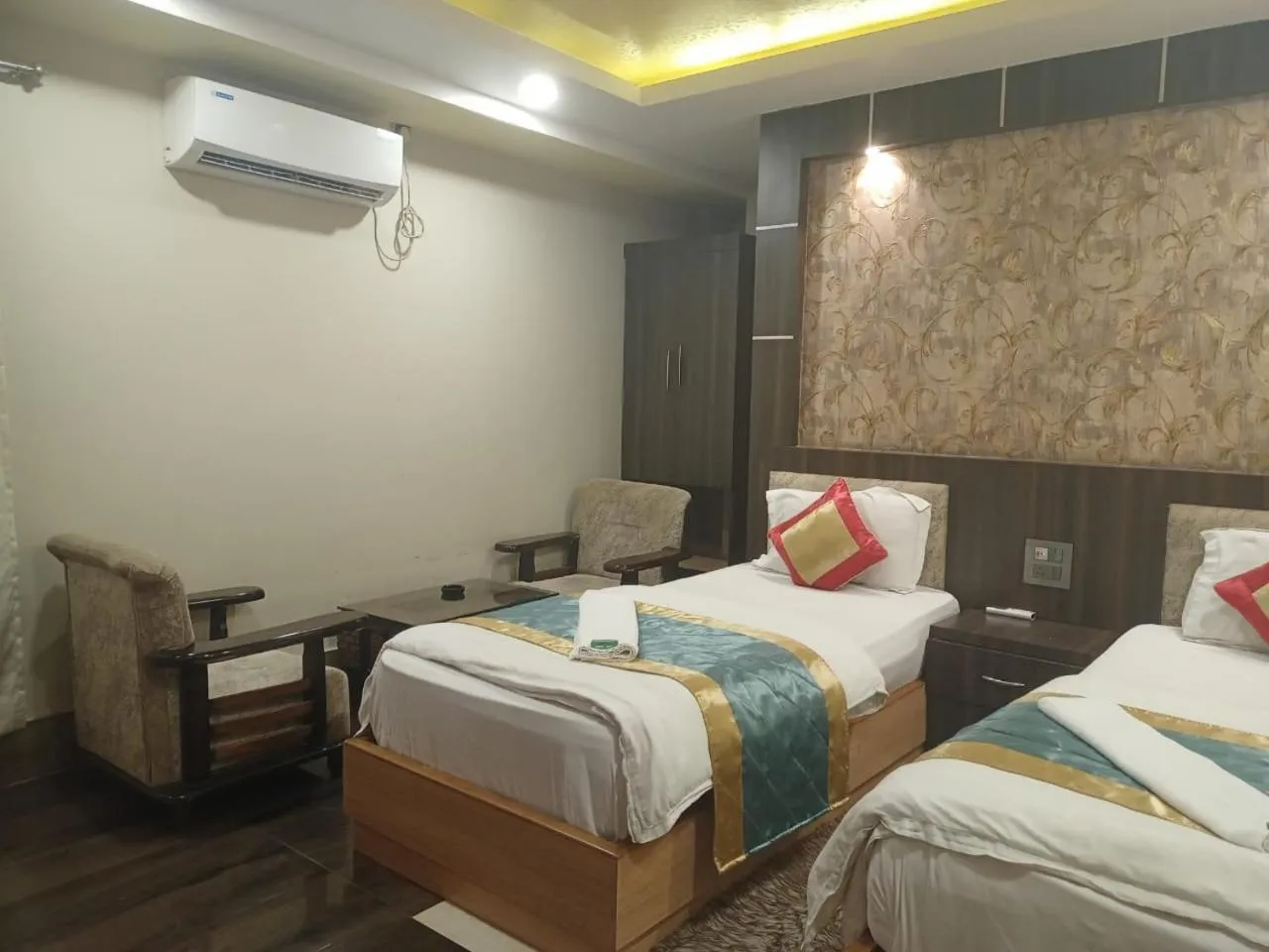 Bed in The Brahmaputra Hotel