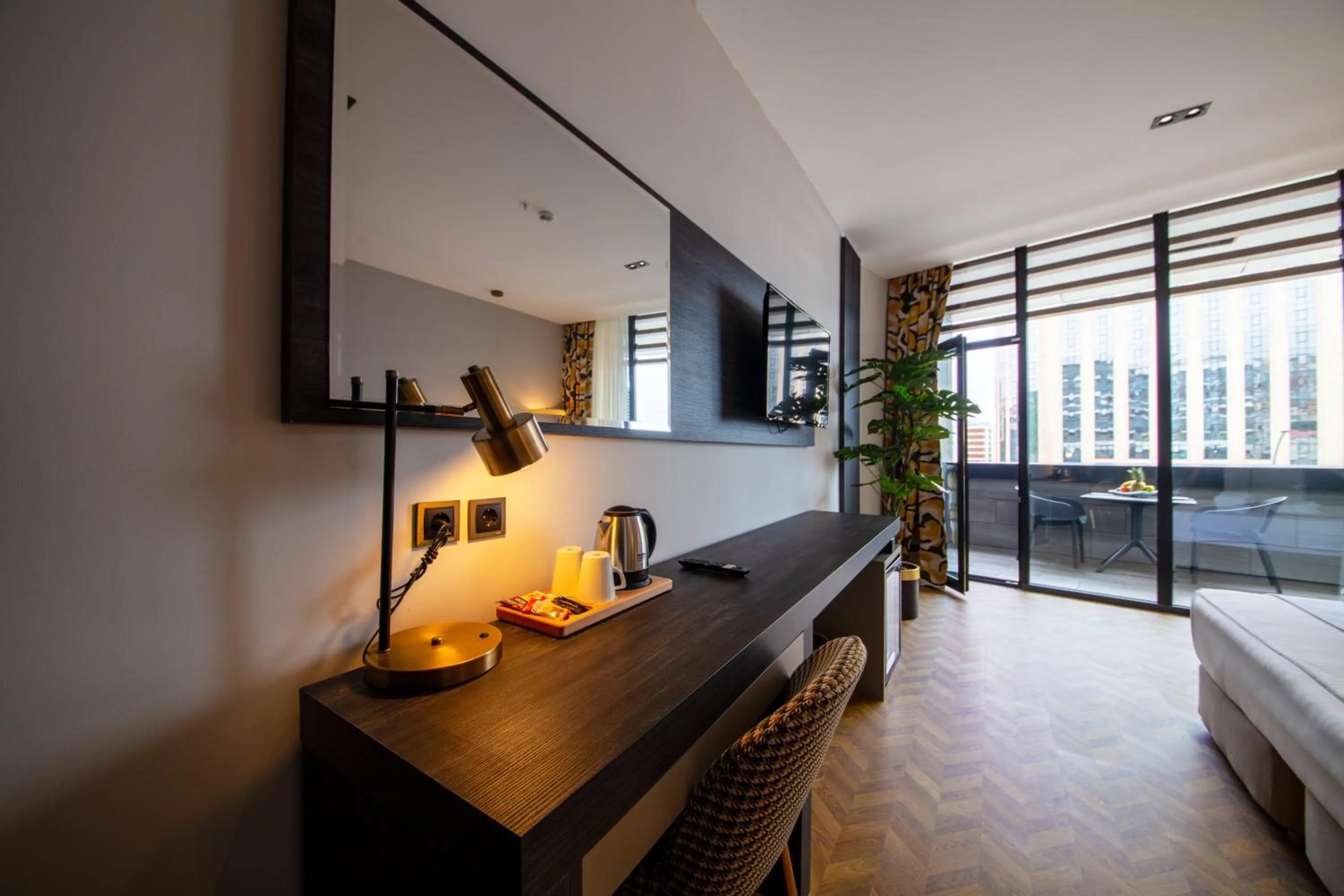 Seating area, Bed in V Center Hotel