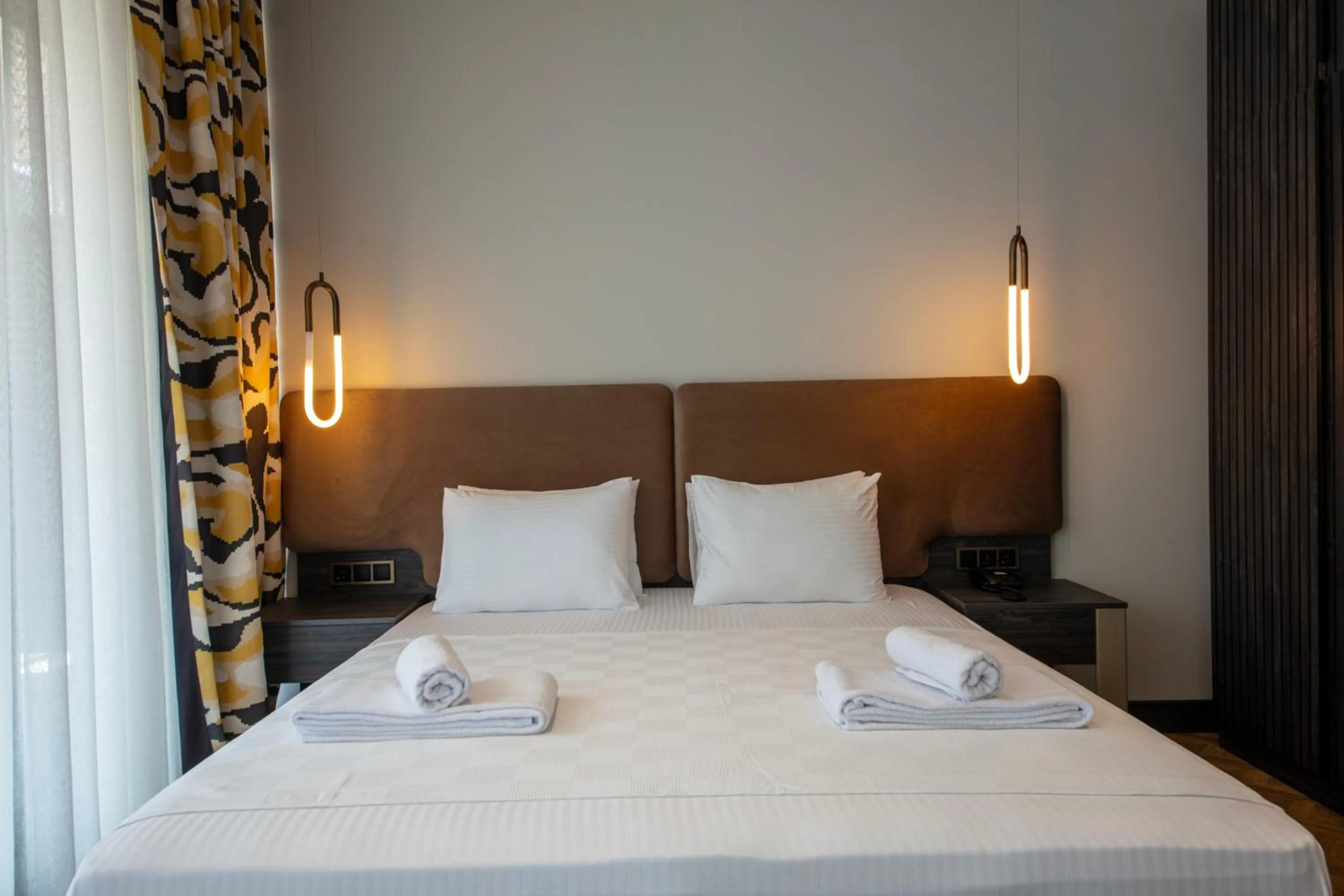 Bed in V Center Hotel