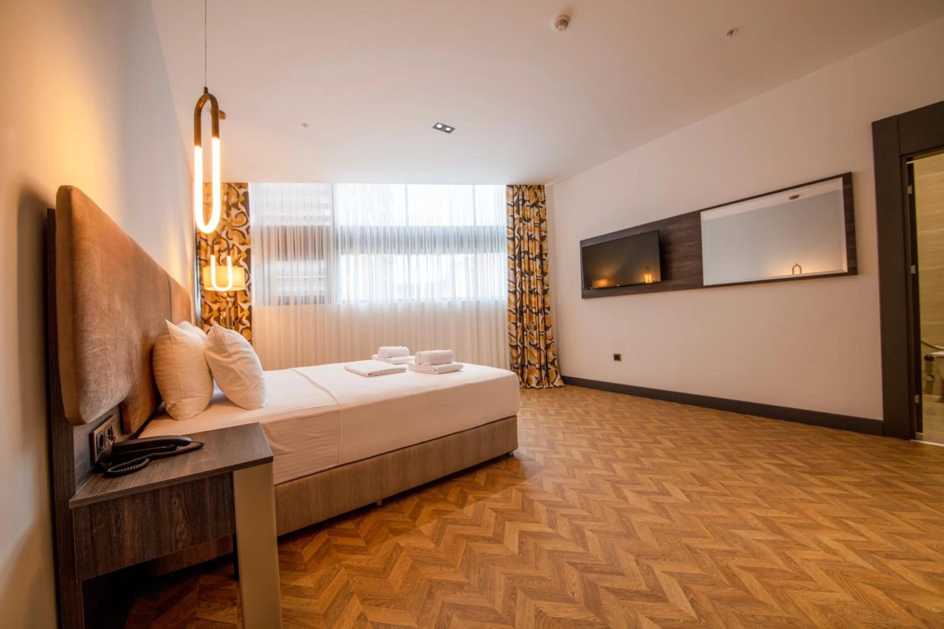 Bed in V Center Hotel