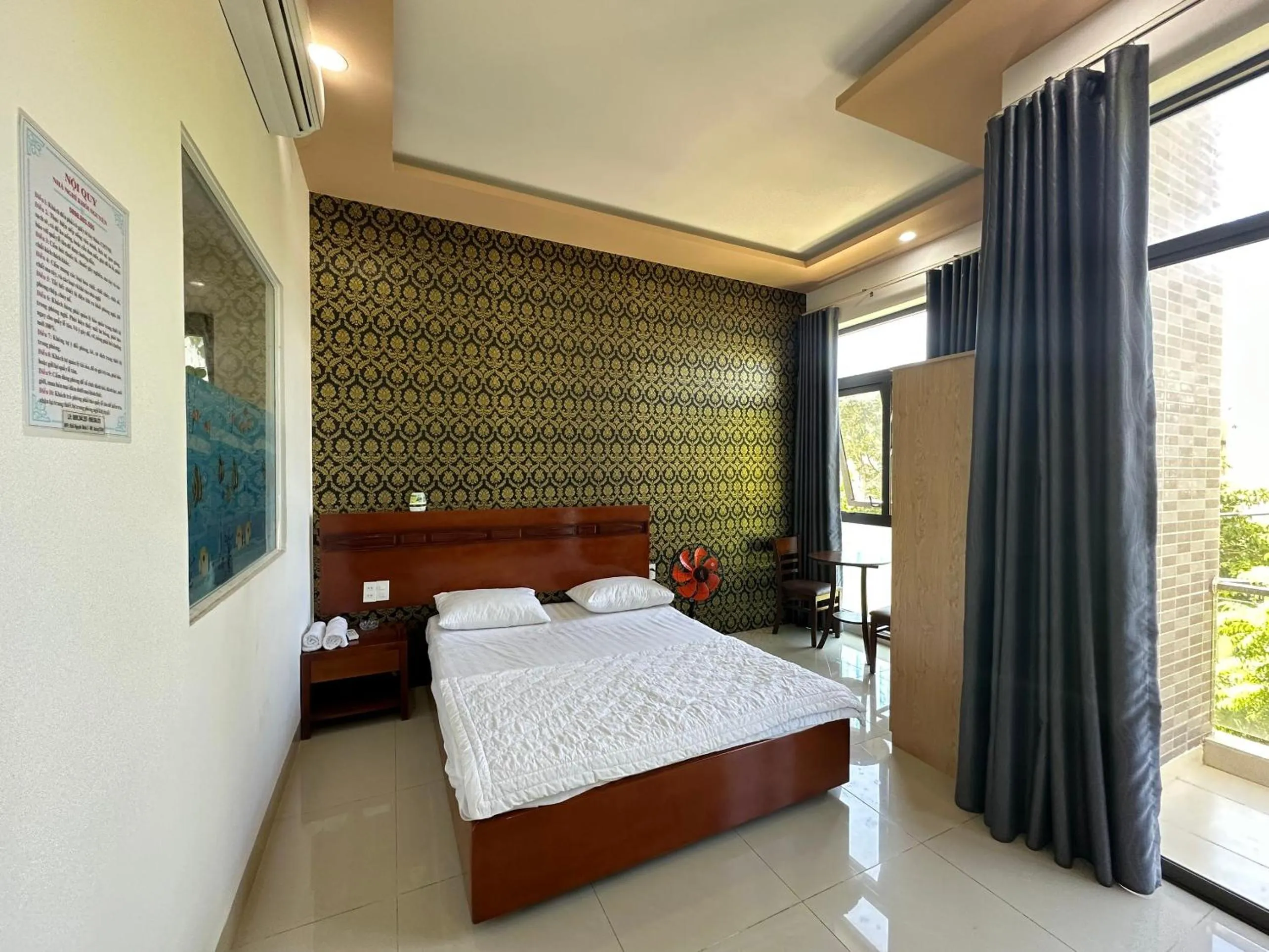 Bedroom in OYO 1191 Happy Motel