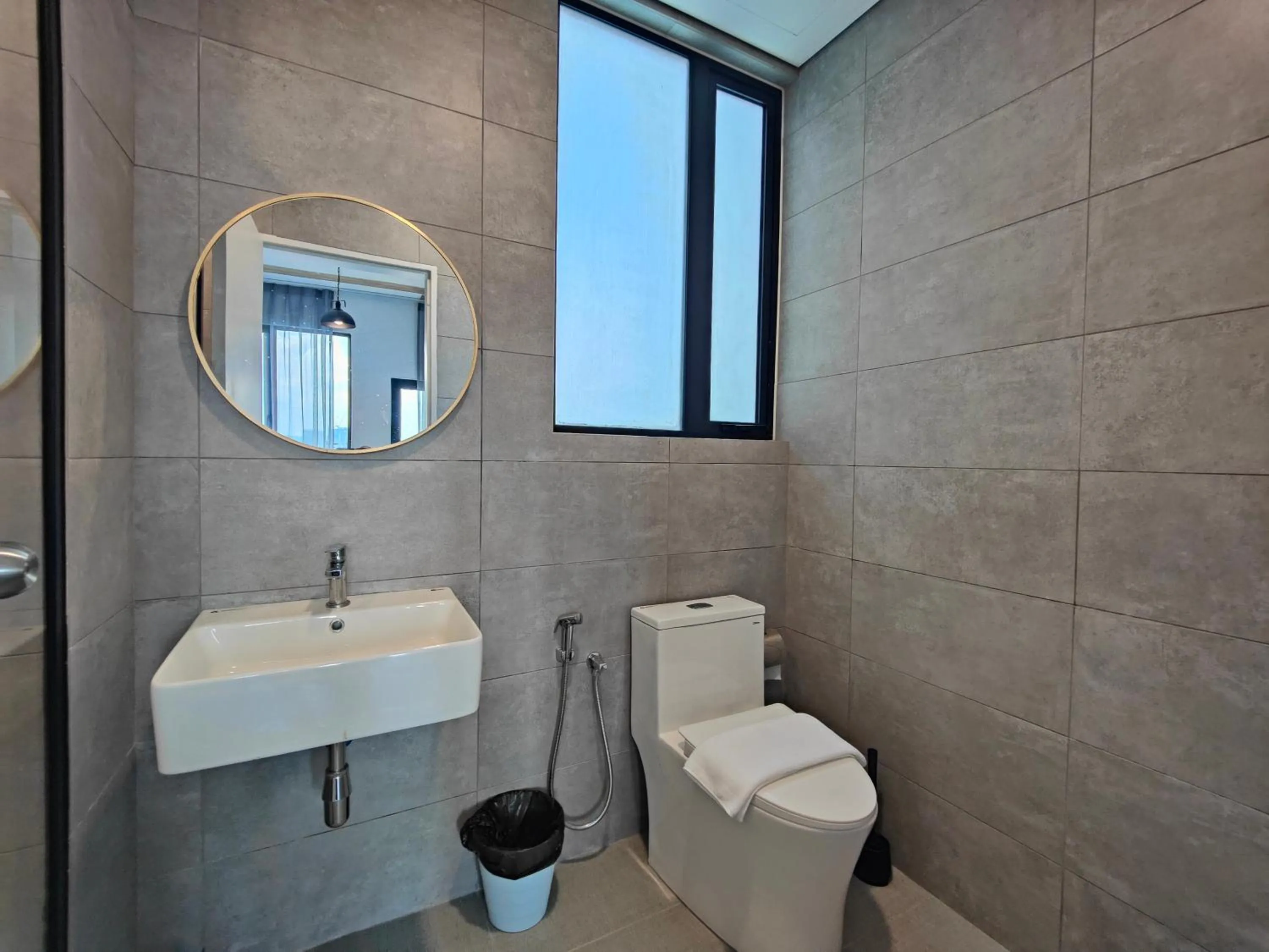 Toilet in Cubic Botanical Suites Bangsar South by HomeBrickz