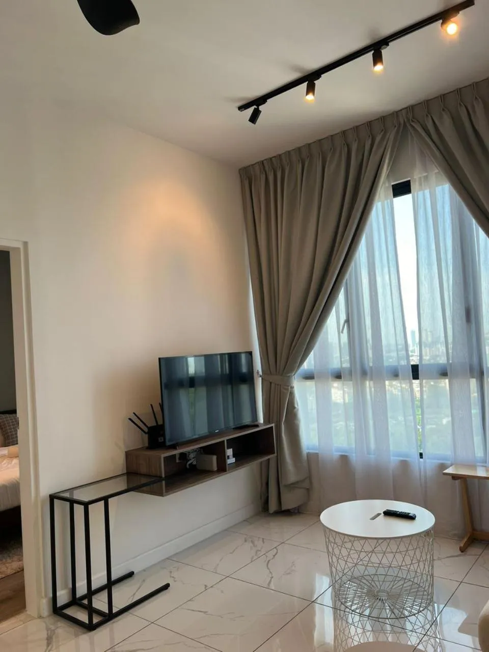 Communal lounge/ TV room in Cubic Botanical Suites Bangsar South by HomeBrickz