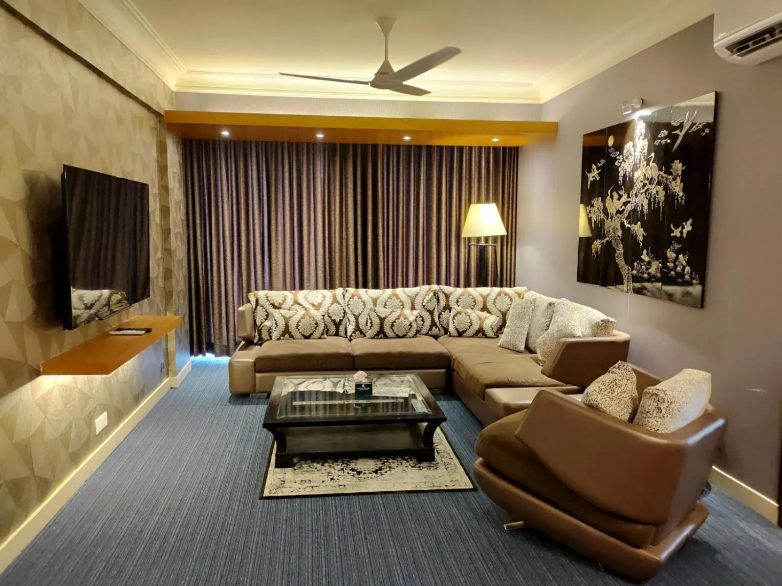 Seating area in Royal Pearl Suites
