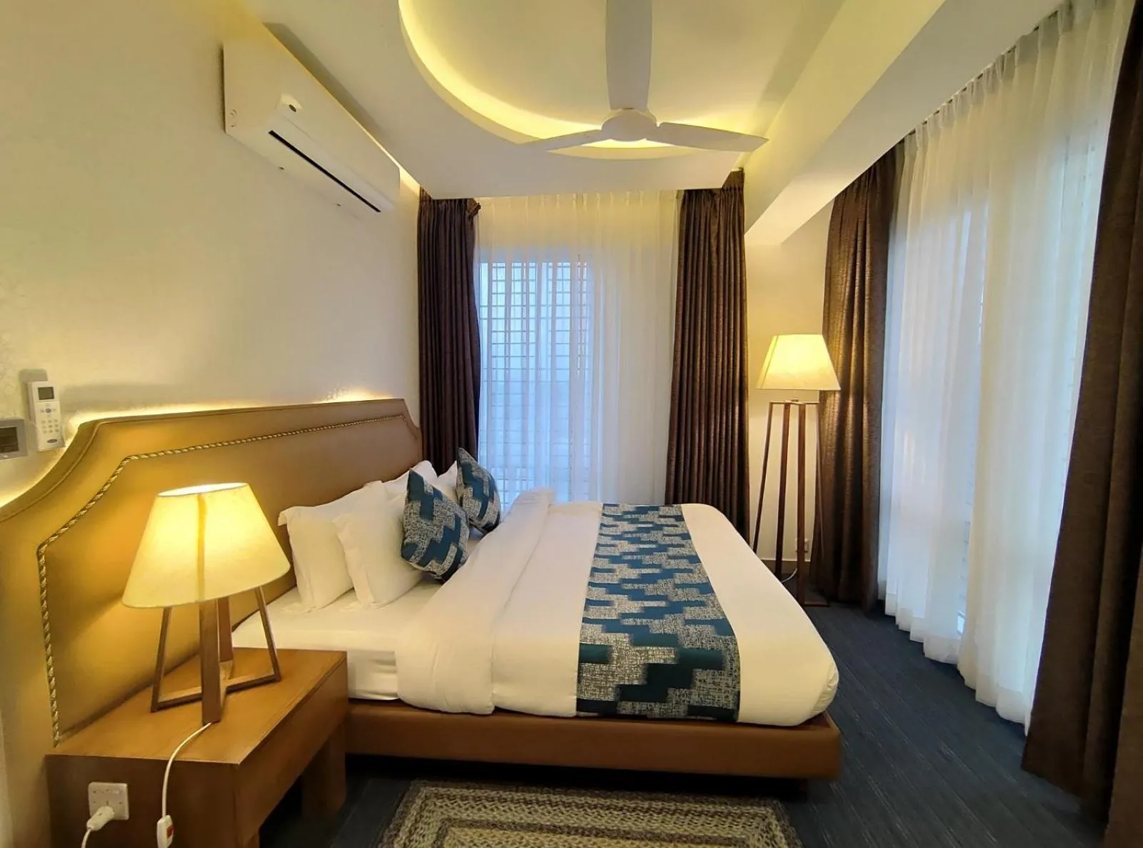 Bed in Royal Pearl Suites