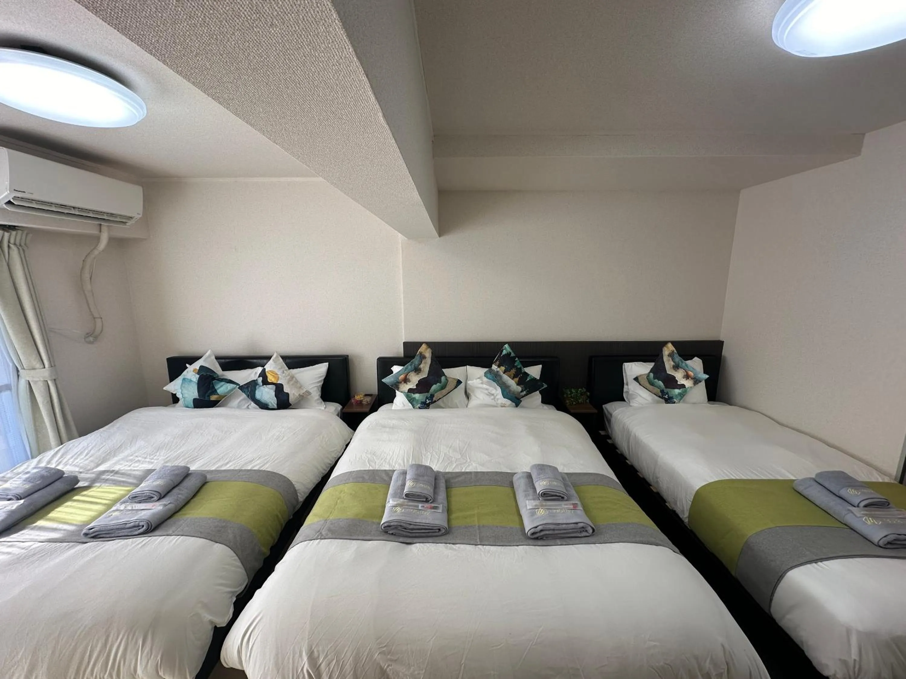 Bed in nestay apartment tokyo otsuka