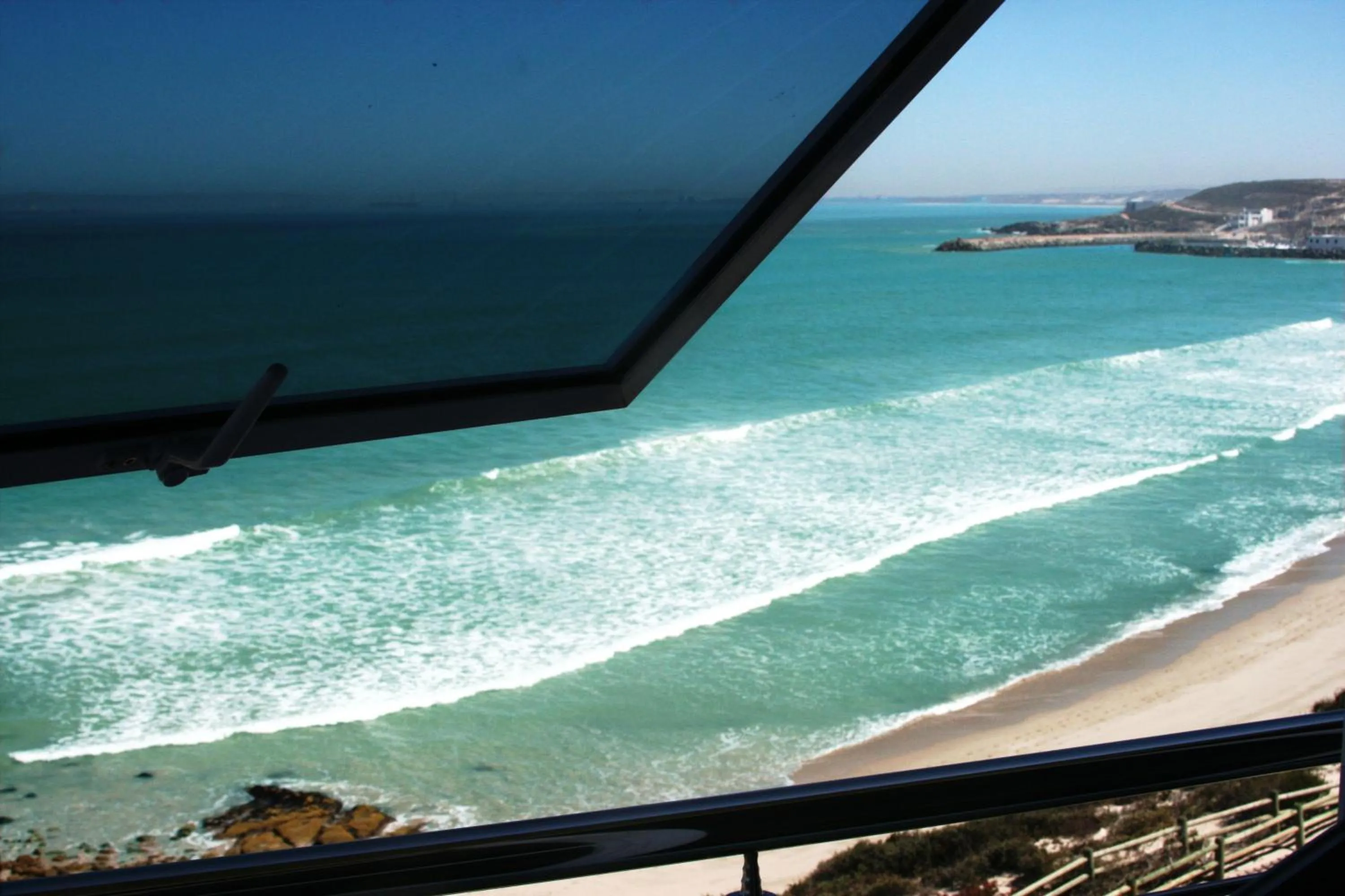 Bed in Crystal Lagoon Lodge