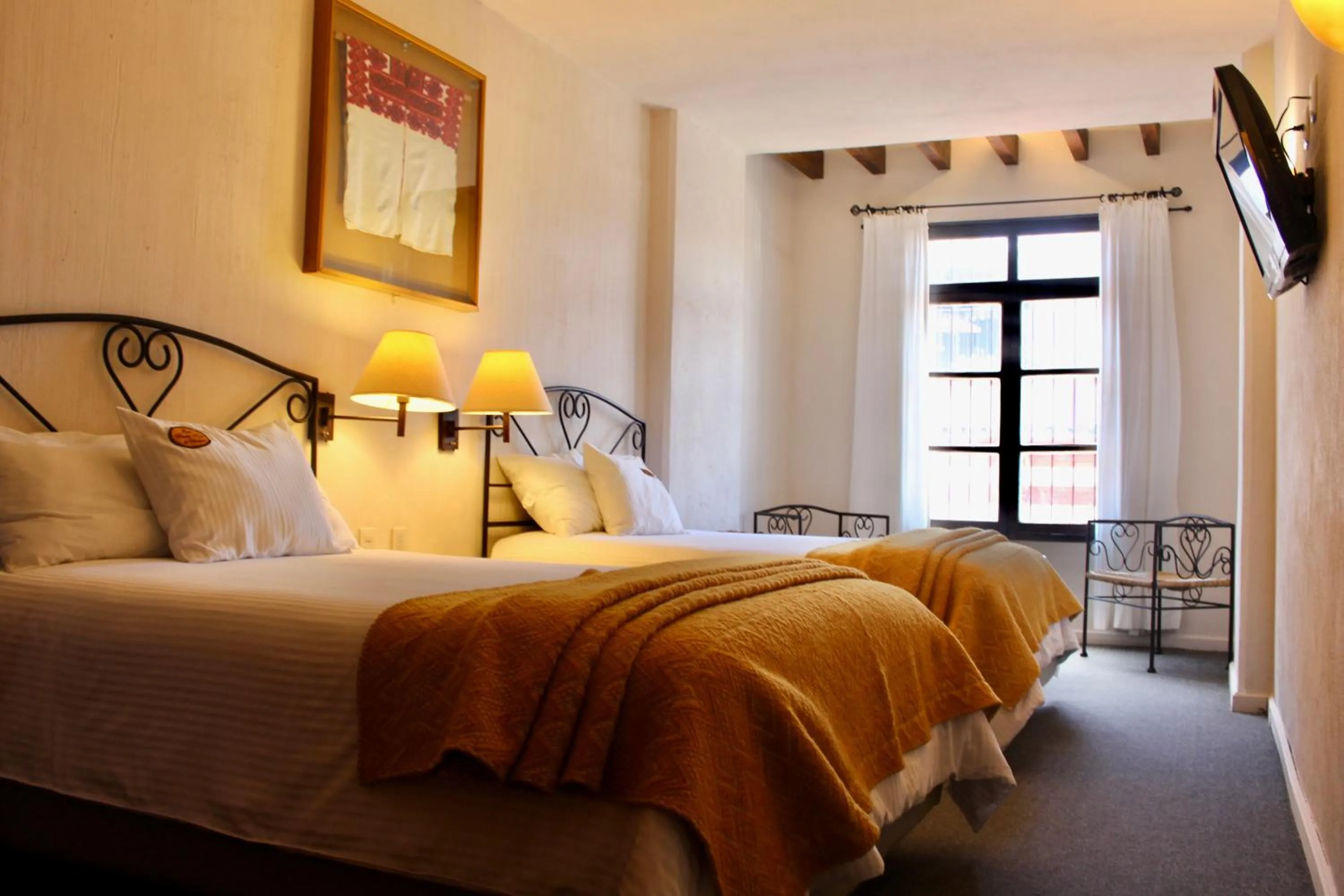 Bed in Mision Grand San Cristobal de las Casas