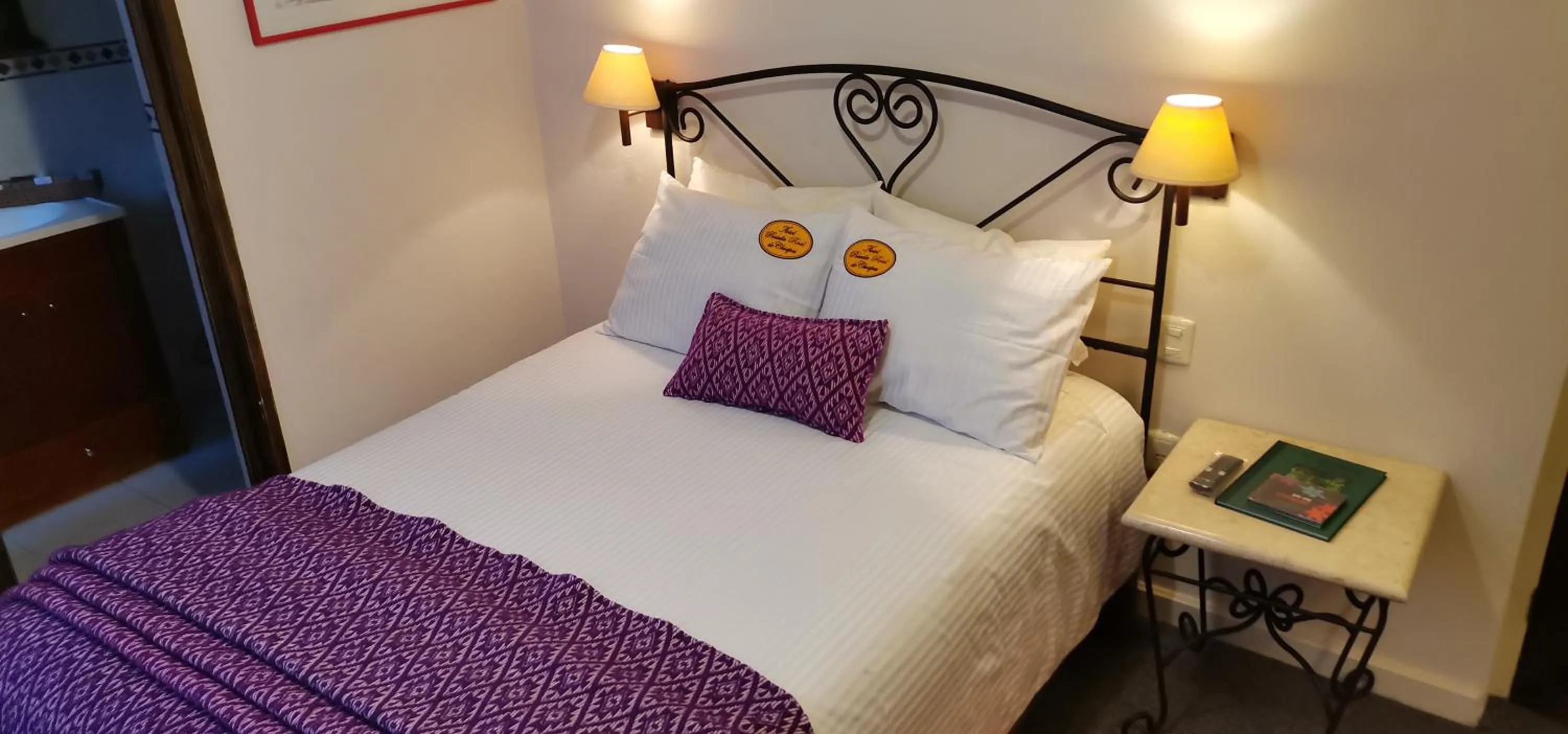 Bed in Mision Grand San Cristobal de las Casas